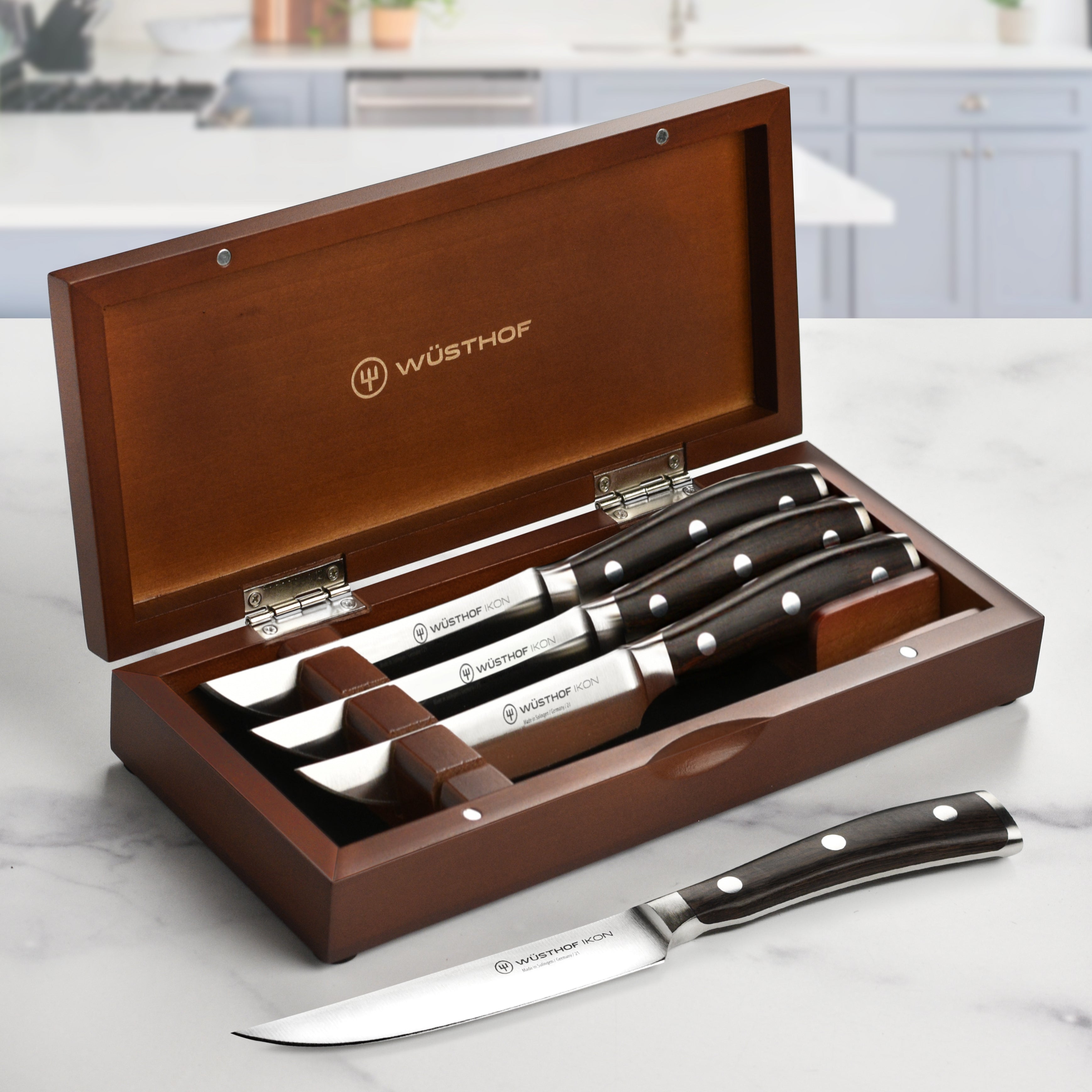 High-carbon steak knives with blackwood handles in a knife block