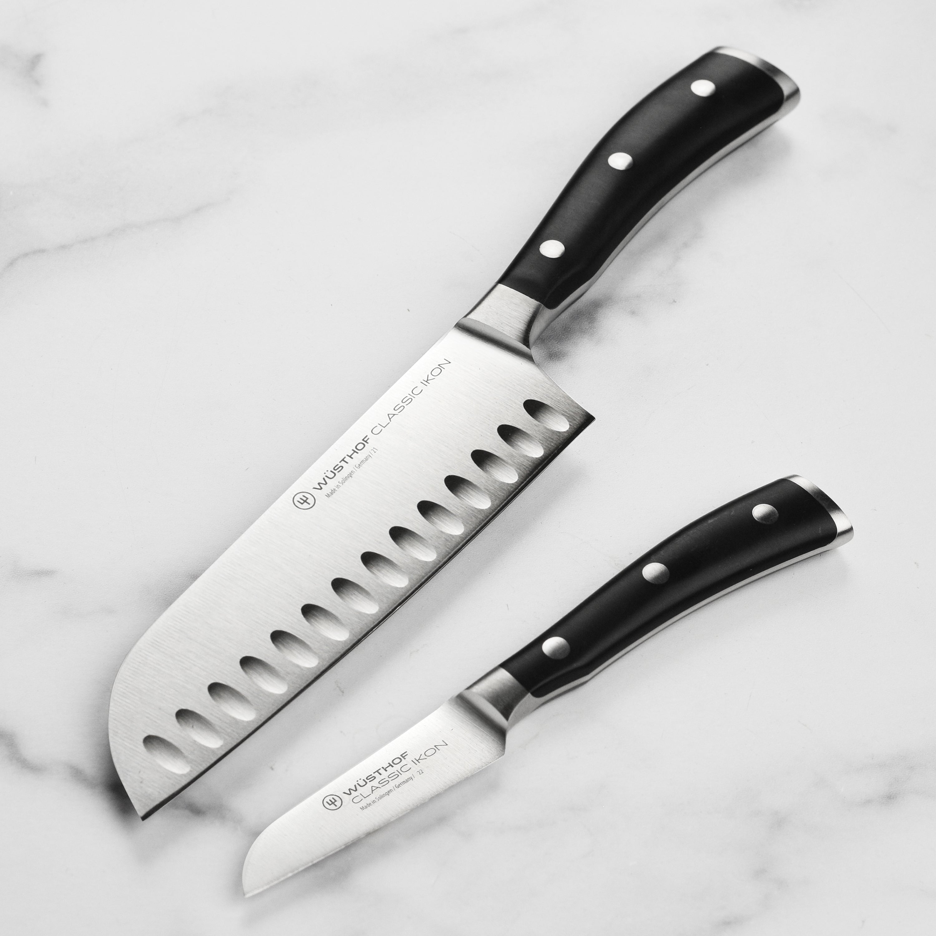 Wusthof Classic Ikon chef knife set with precision blades and ergonomic handles, perfect for Asian cuisine.