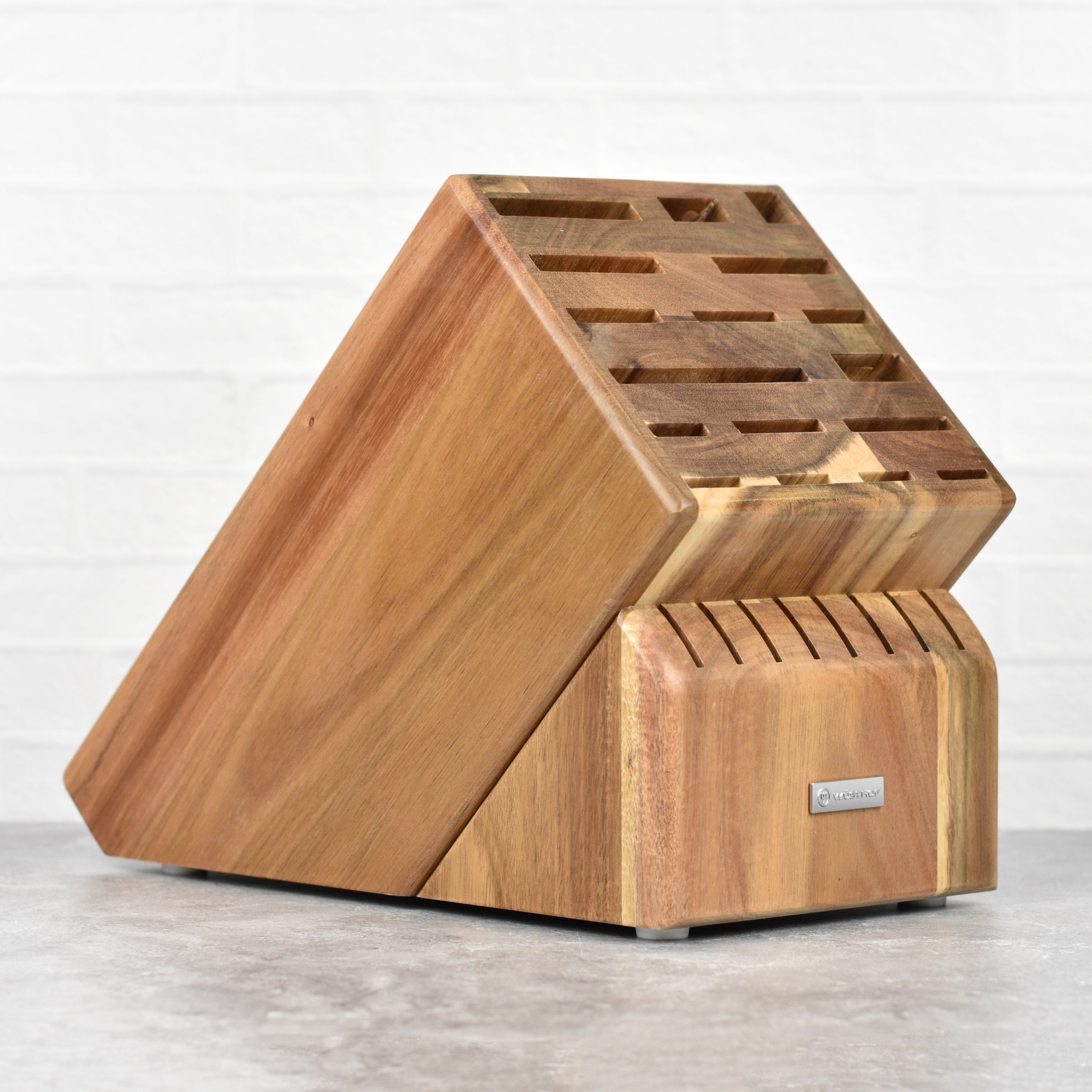 Premium acacia wood knife block showcasing 25 slots for various knives.