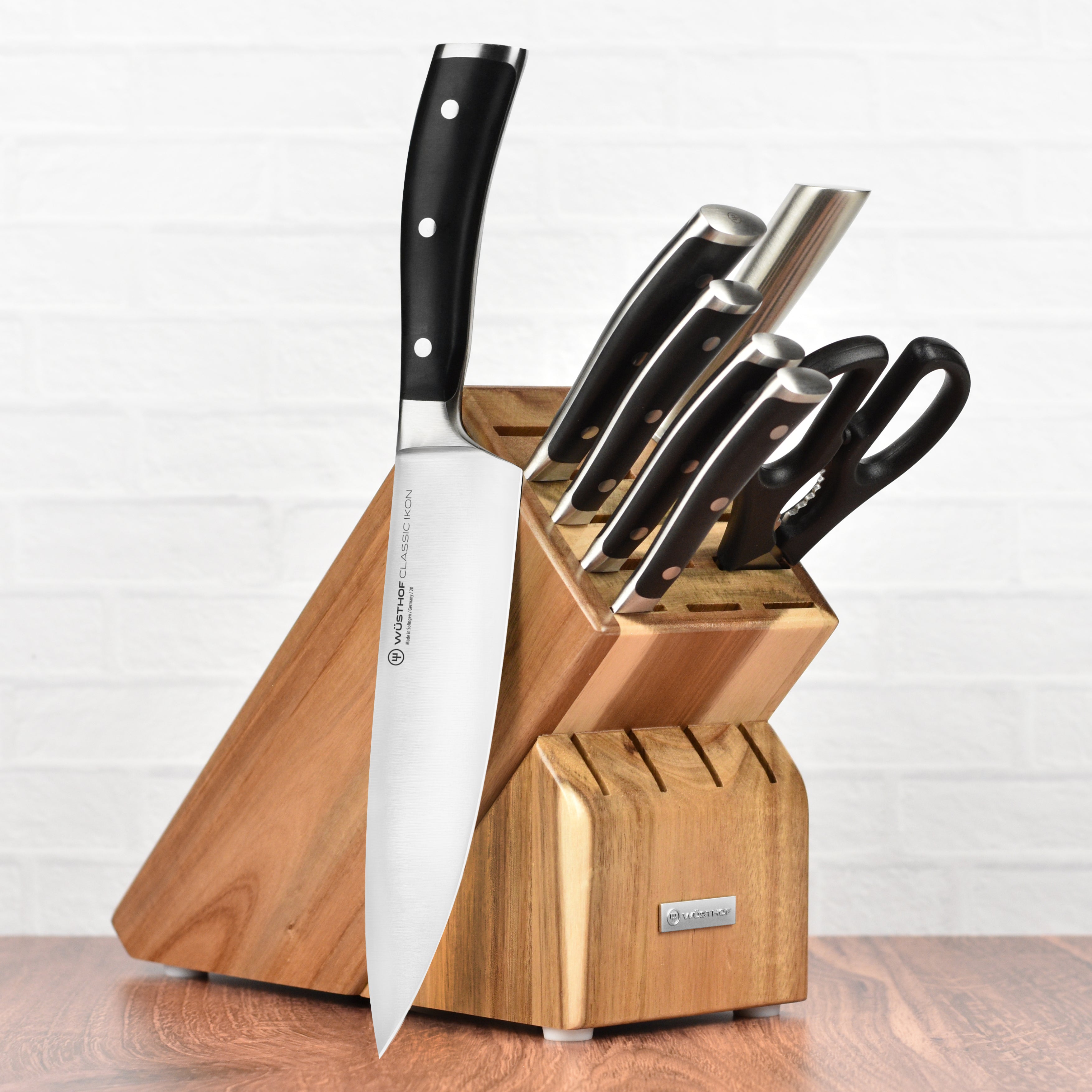 Wusthof Classic Ikon knife block set with high-carbon stainless steel blades on a kitchen counter.