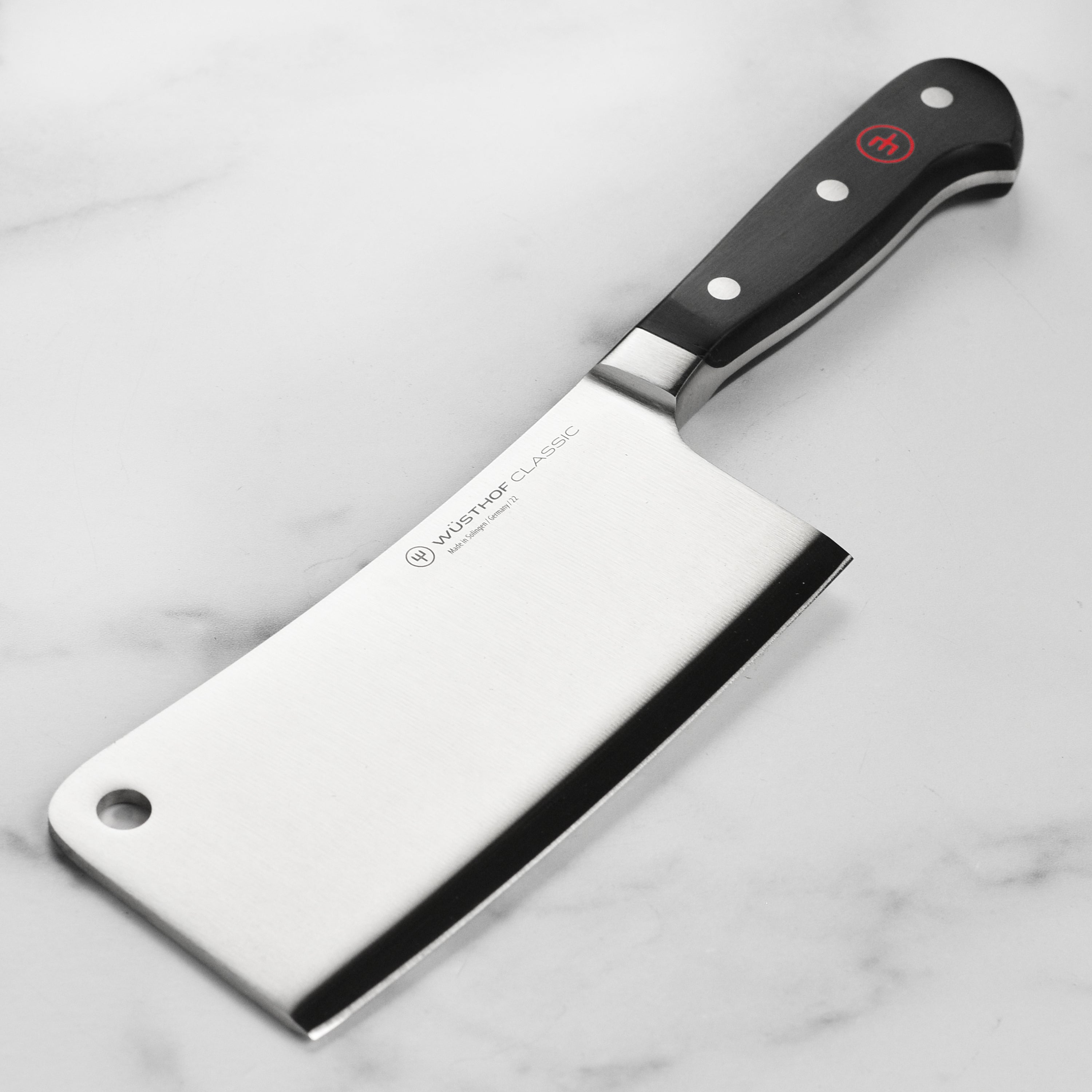 Wusthof Classic meat cleaver showcasing its sharp blade and sturdy handle, perfect for kitchen tasks.