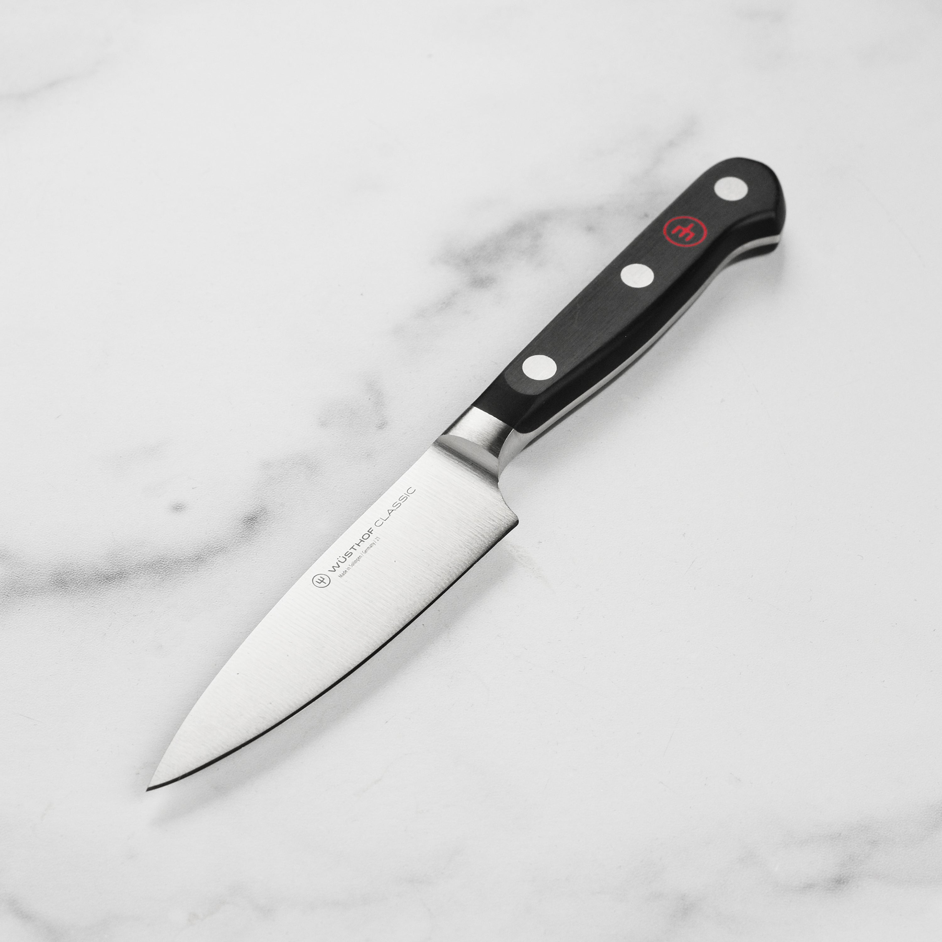Close-up of the Wusthof Classic 4-inch paring knife blade showing sharp edge