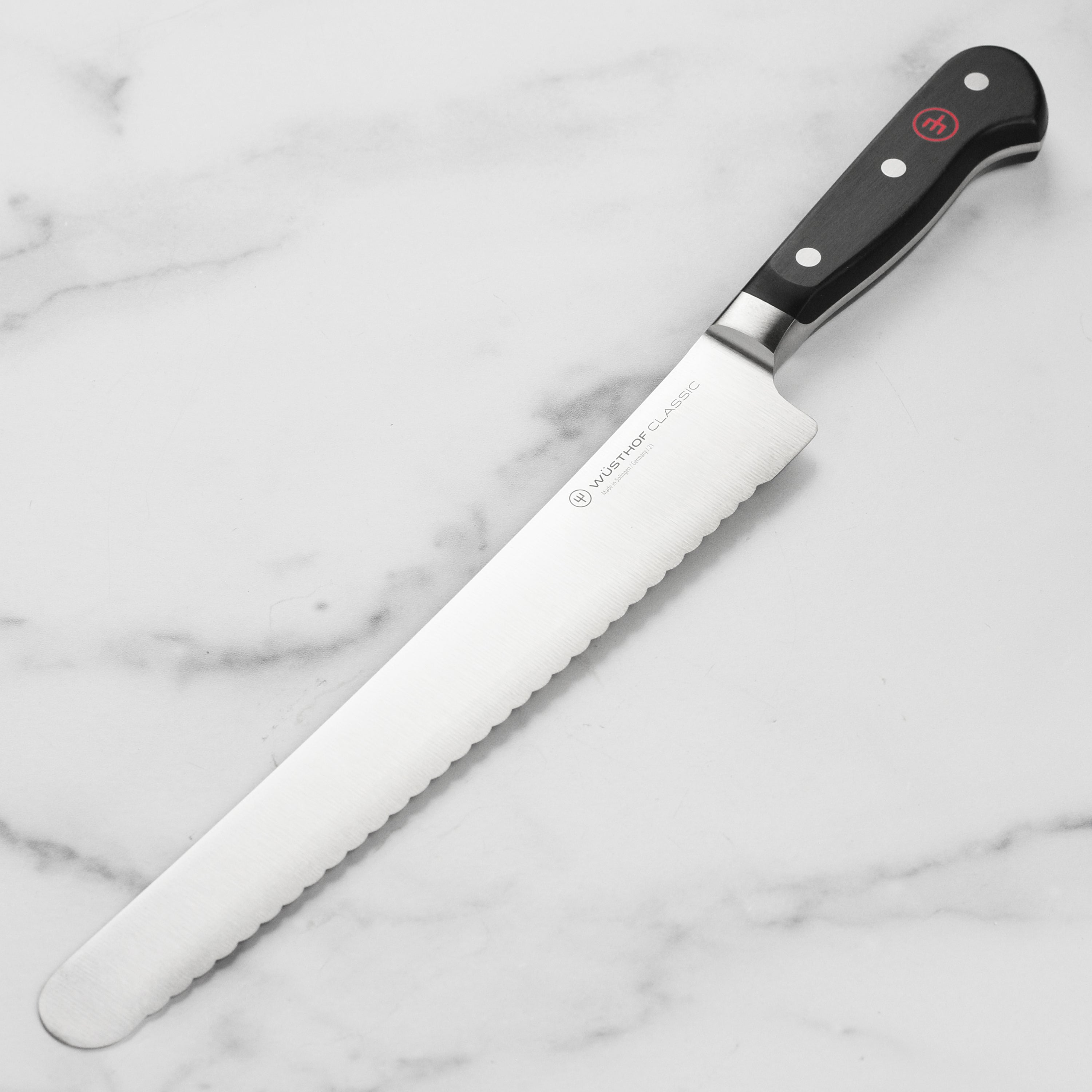 Close-up of Wusthof Premium Chef Slicer highlighting the sharp blade and POM handle.