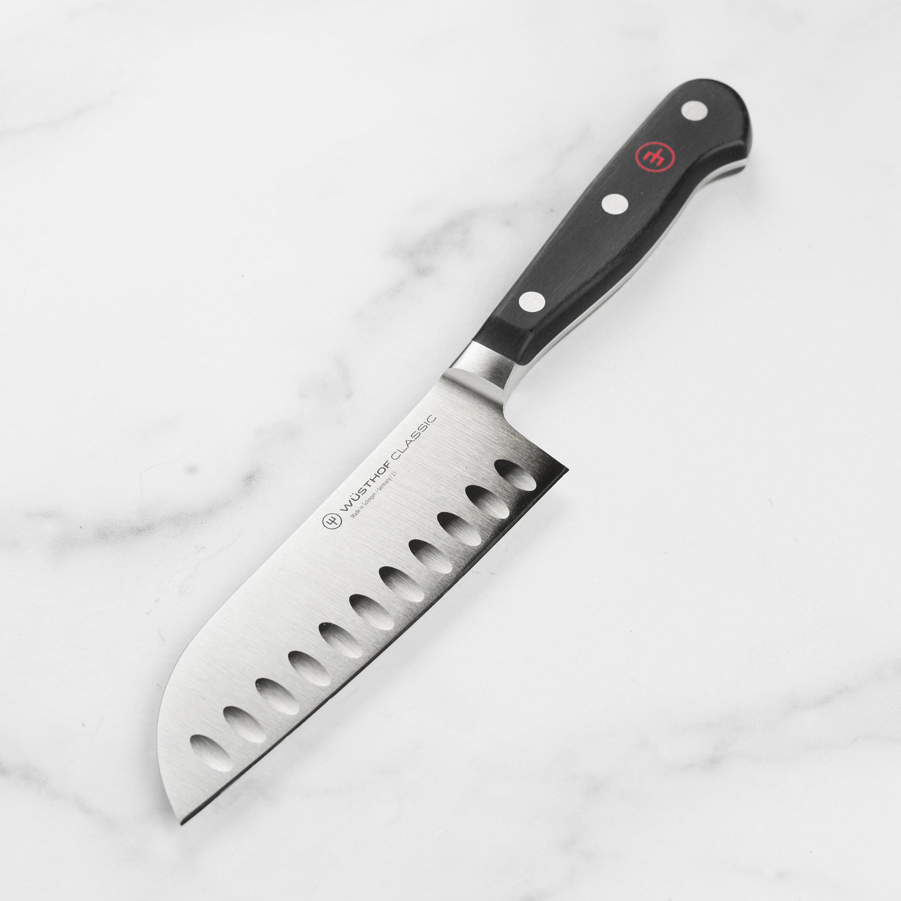 Wusthof Classic 5-inch Santoku knife with hollow edge close-up for sharpness detail