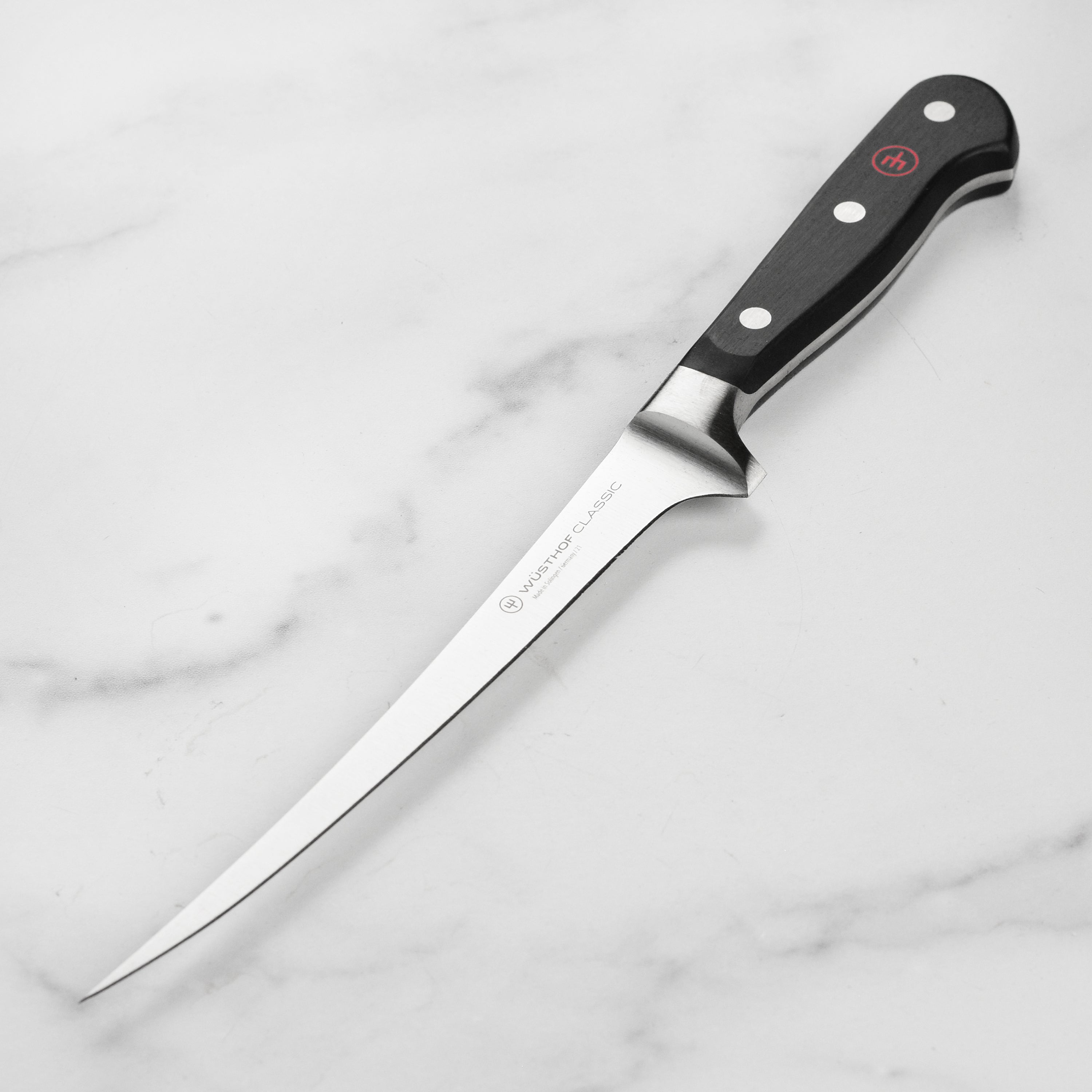Wusthof Classic 7-Inch Professional Fish Fillet Knife with a sharp blade and ergonomic handle, perfect for filleting fish.