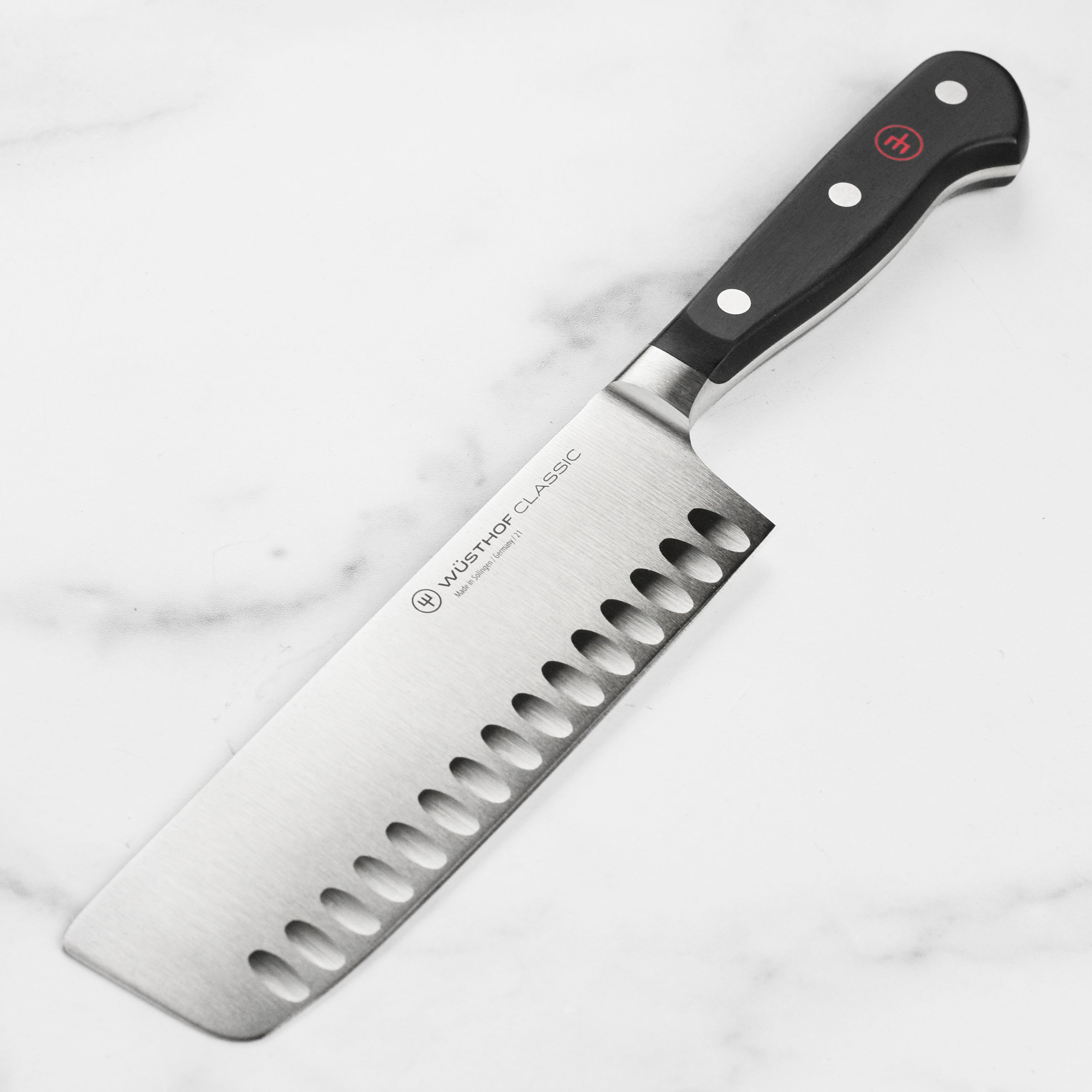 Wusthof Classic Nakiri knife showcasing its sharp blade and ergonomic handle.