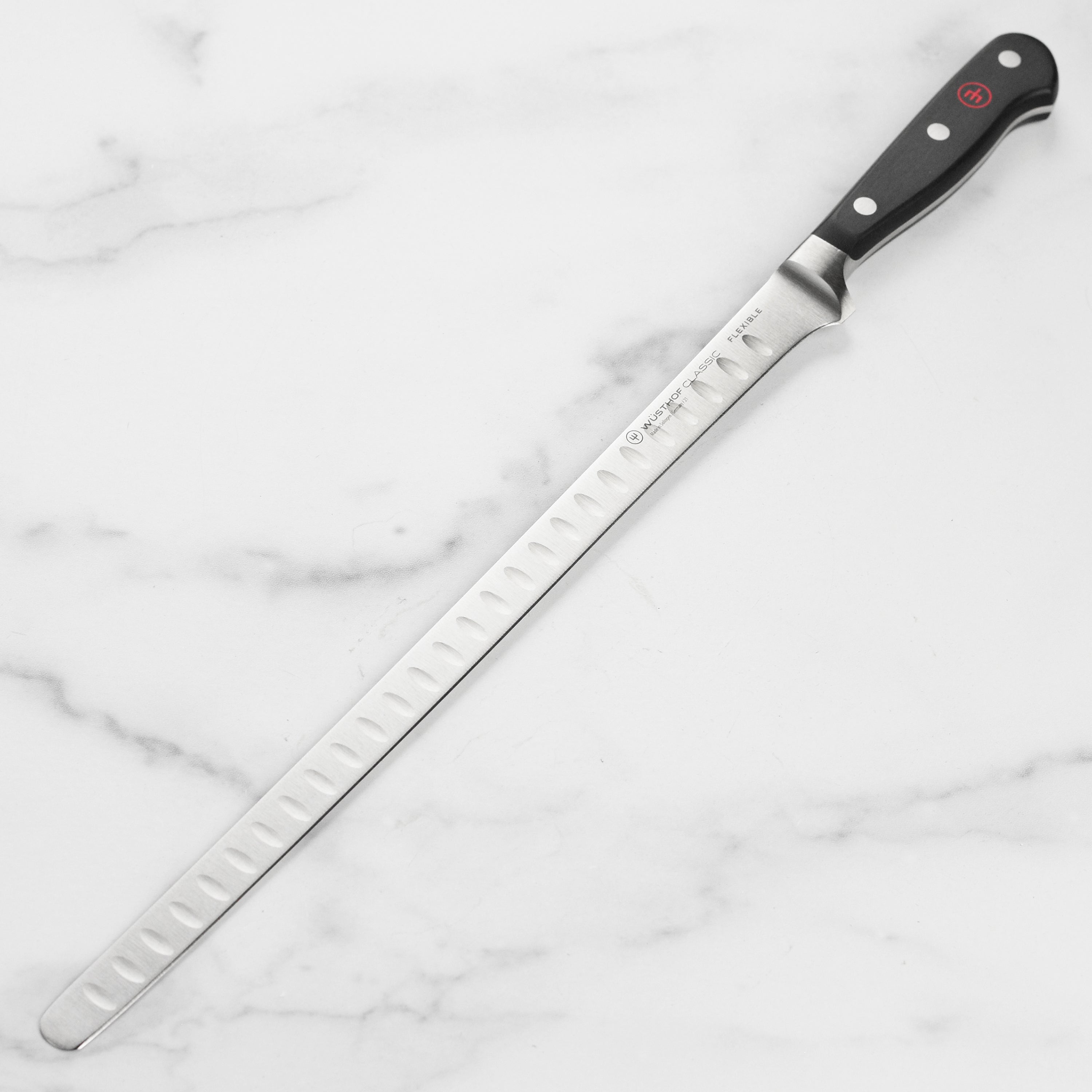 Wusthof Classic 12-Inch Flexible Salmon Slicing Knife with a sharp blade and ergonomic handle.