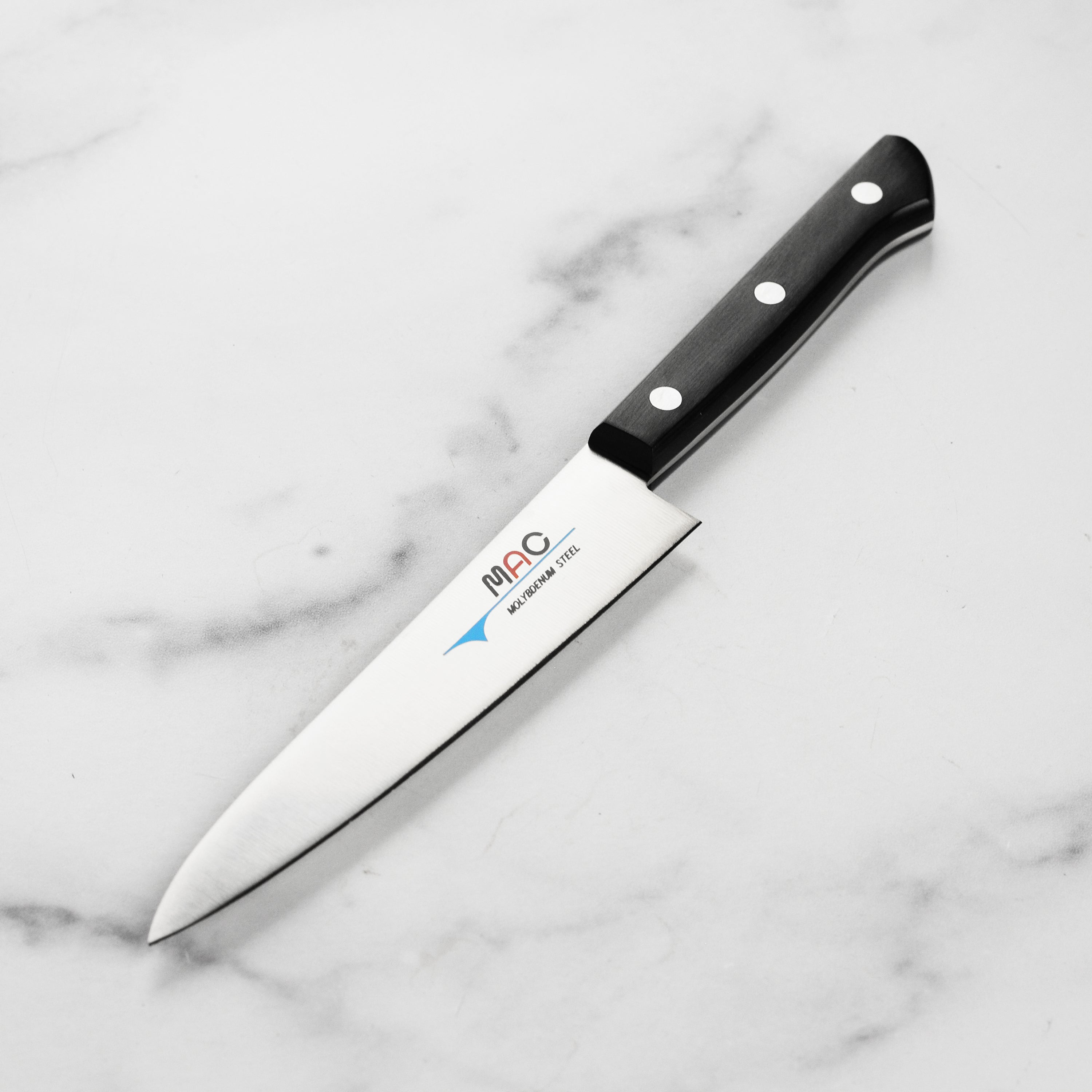MAC Chef Series Premium Utility Knife angled view highlighting the blade and Pakkawood handle.