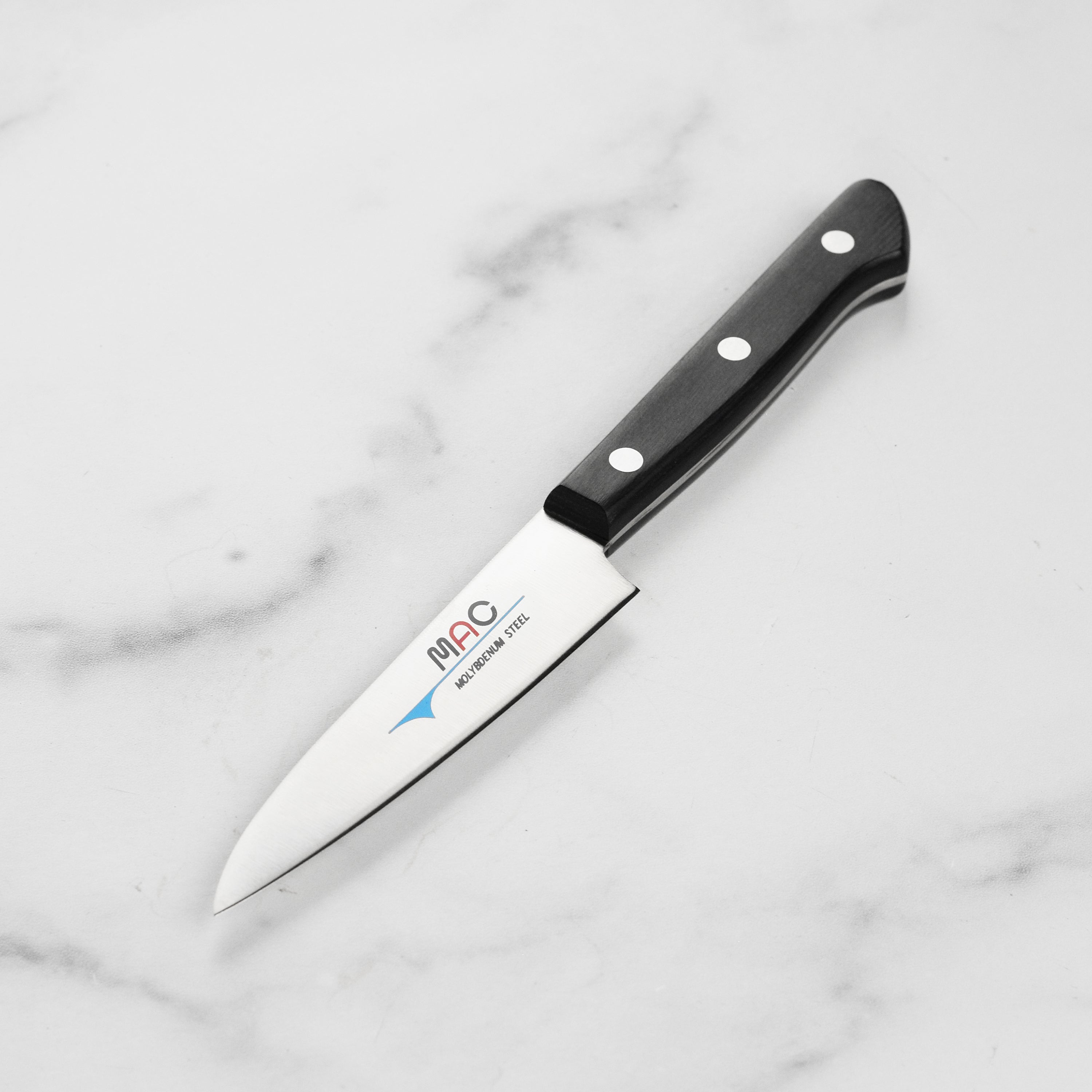 Close-up of MAC Chef Series paring knife showing the high-quality blade and Pakkawood handle.