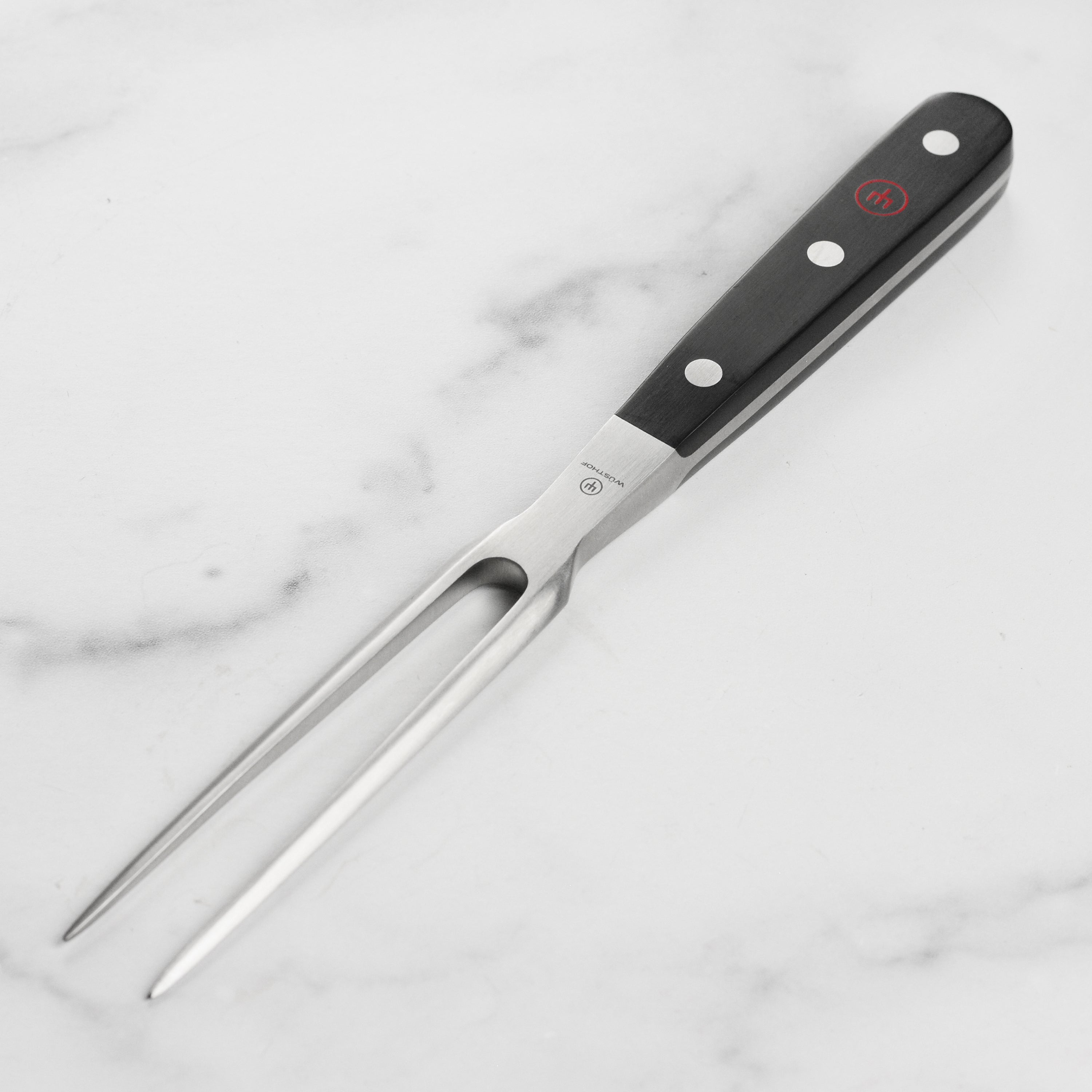 Wusthof Classic carving fork with a high-carbon stainless steel finish, ideal for meat carving.