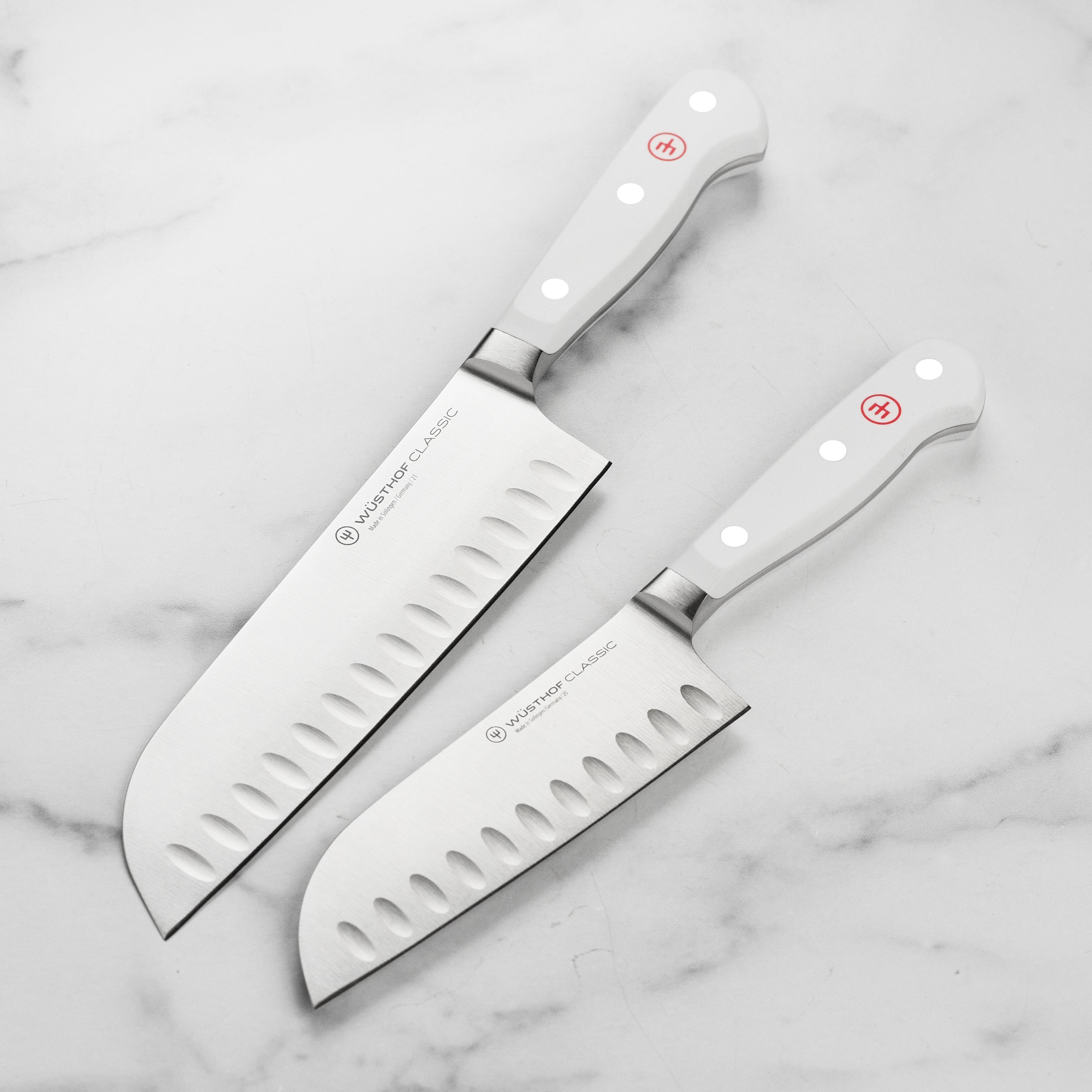 Wusthof Classic White Santoku Knife Set from the side showing precision hollow edge blades.