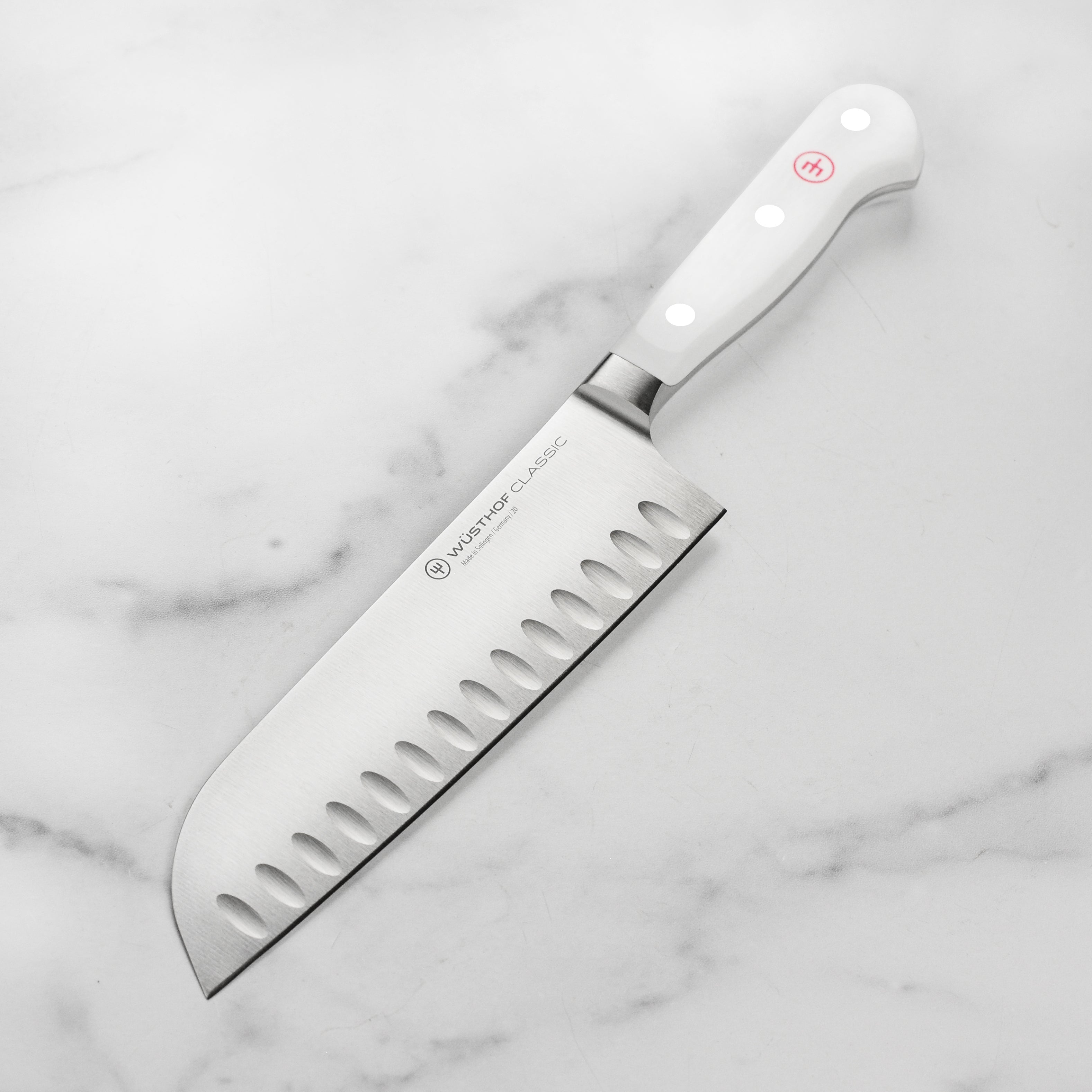 Wusthof Classic 7-Inch Santoku Knife showcasing its sharp edge and ergonomic handle.