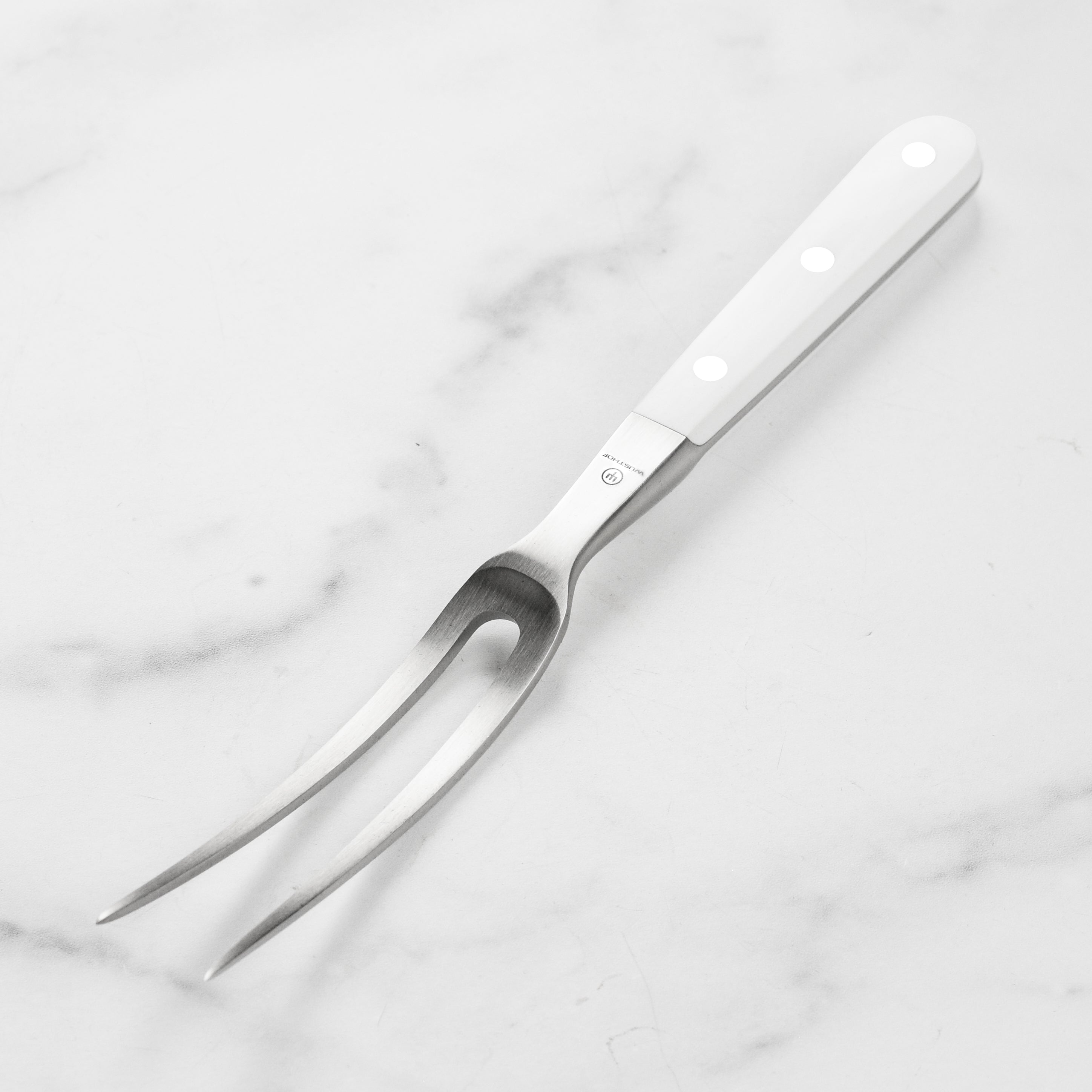 Wusthof Classic carving fork showcasing its ergonomic handle and prongs.