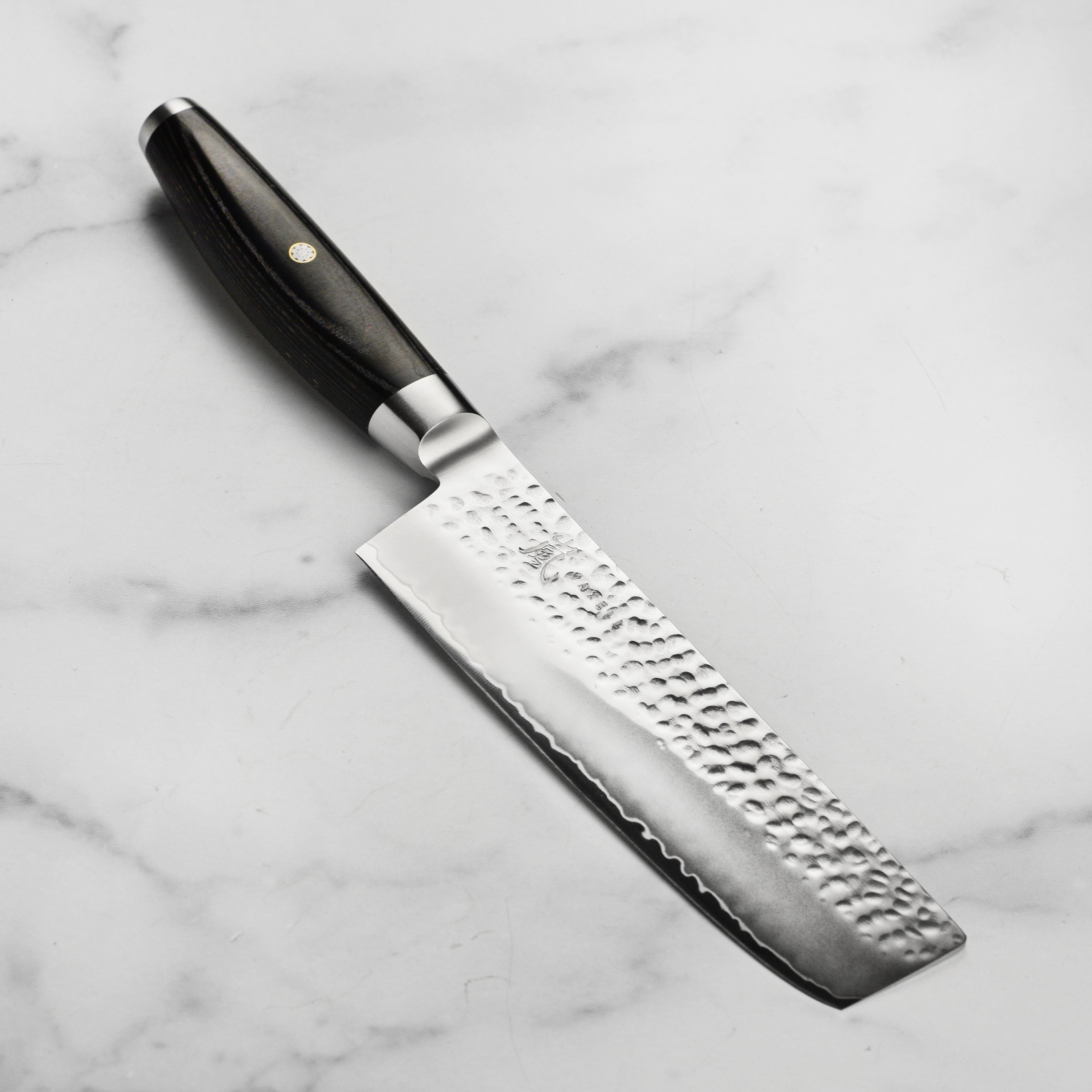 Yaxell Ketu Nakiri Knife showcasing the hammered finish and precision blade angle.