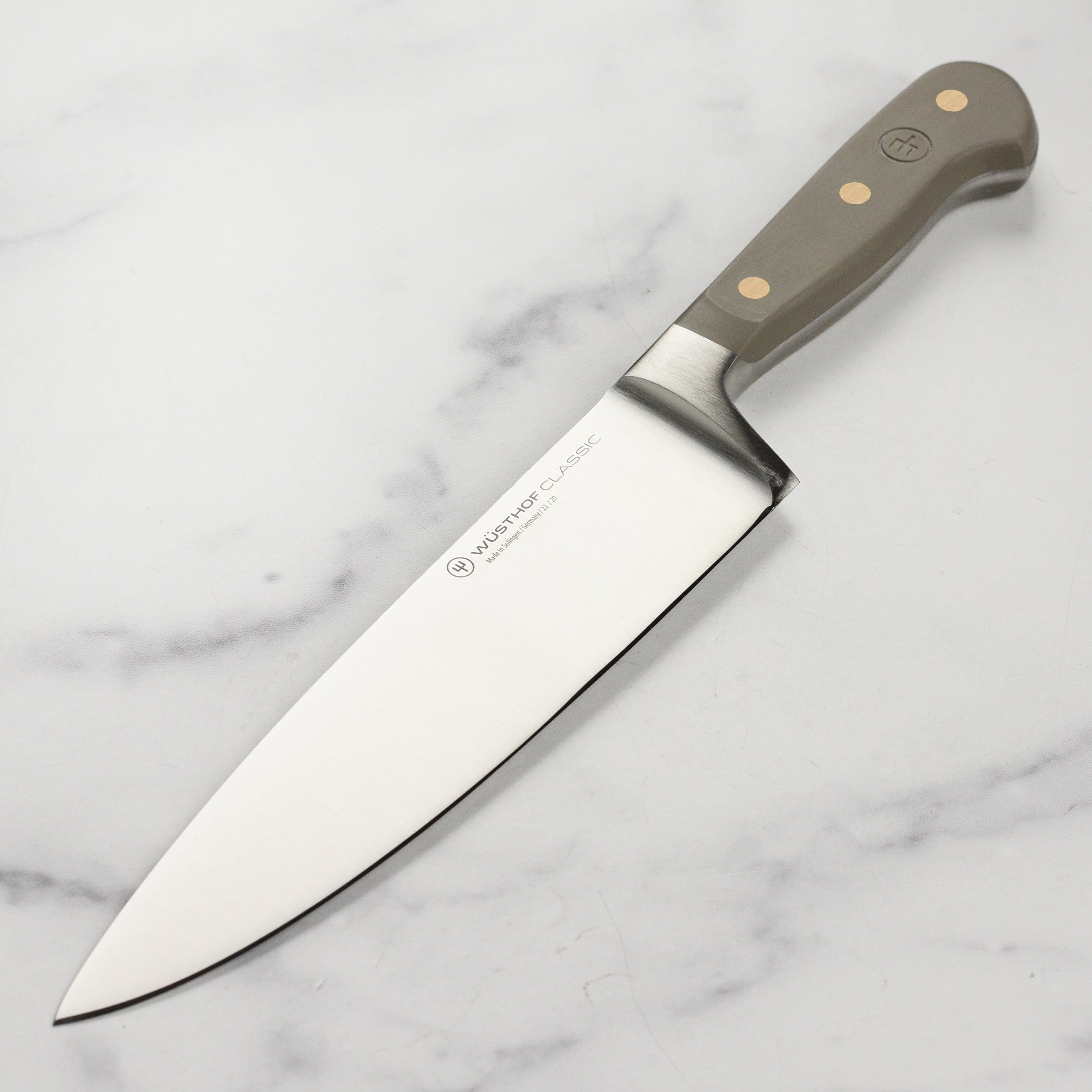Front view of the Wusthof Classic 8-inch chef's knife highlighting its sharp blade and sturdy handle