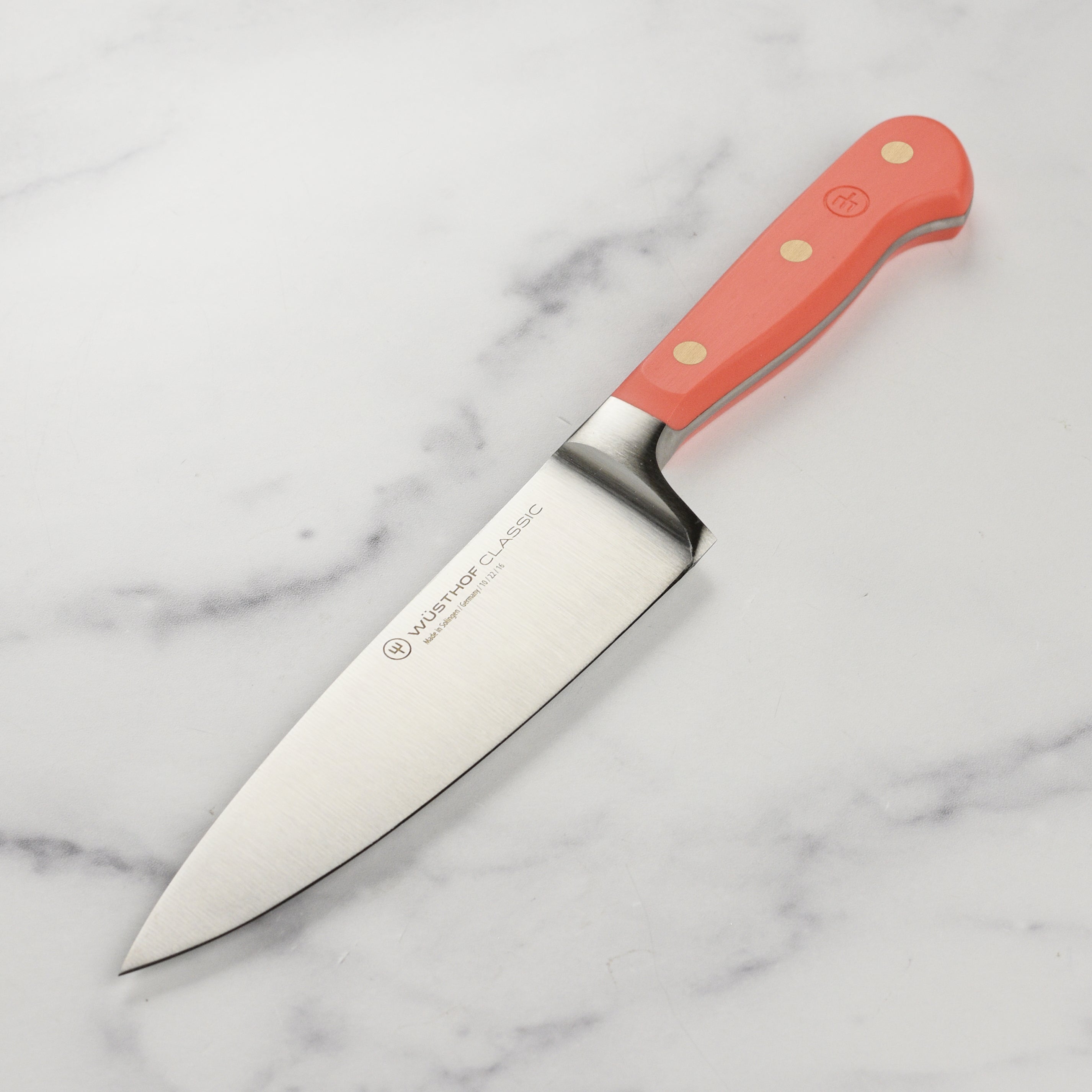 Wusthof Classic 6-inch chef's knife with high-carbon stainless steel blade in a professional kitchen