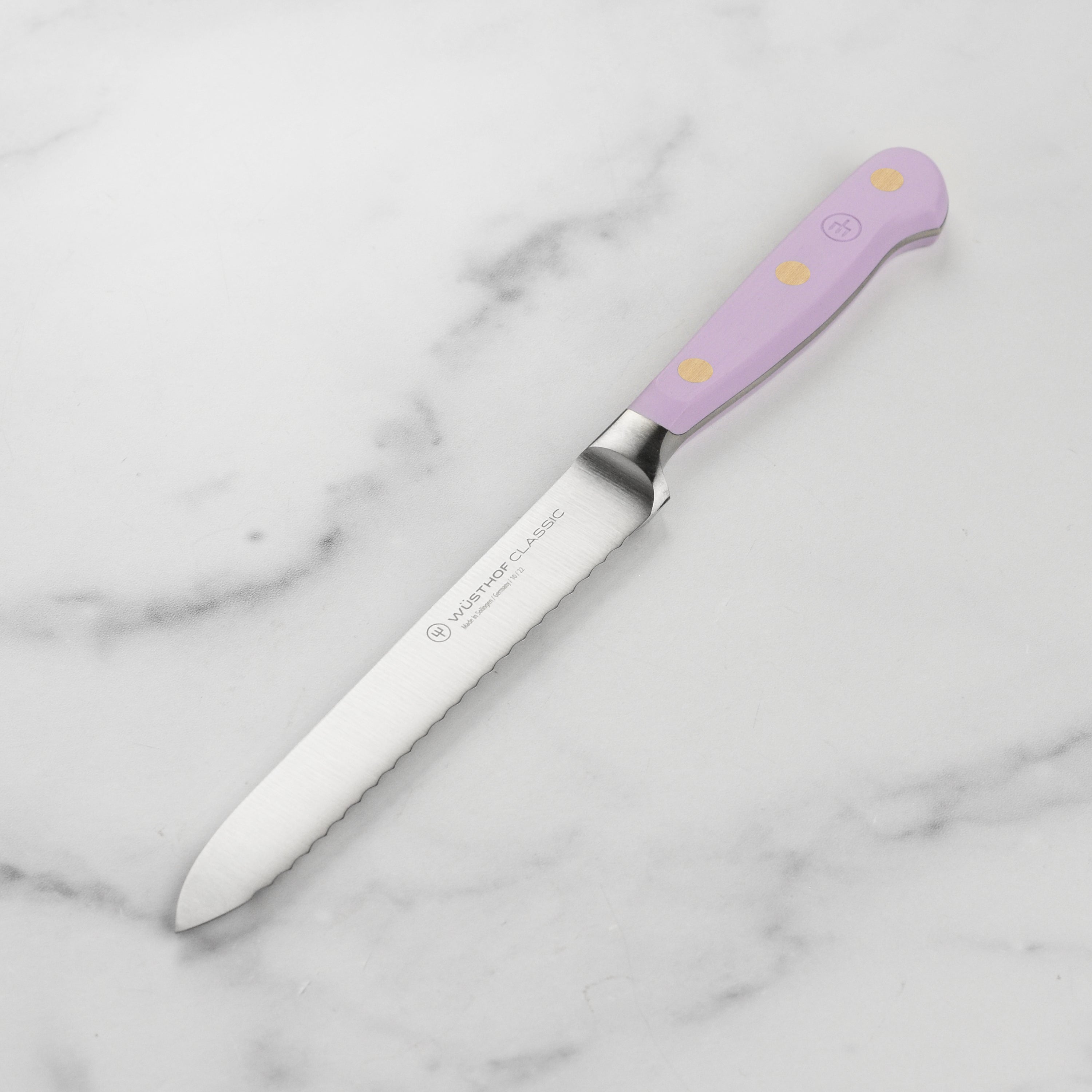 Wusthof Classic Serrated Utility Knife - close-up showing blade and handle design