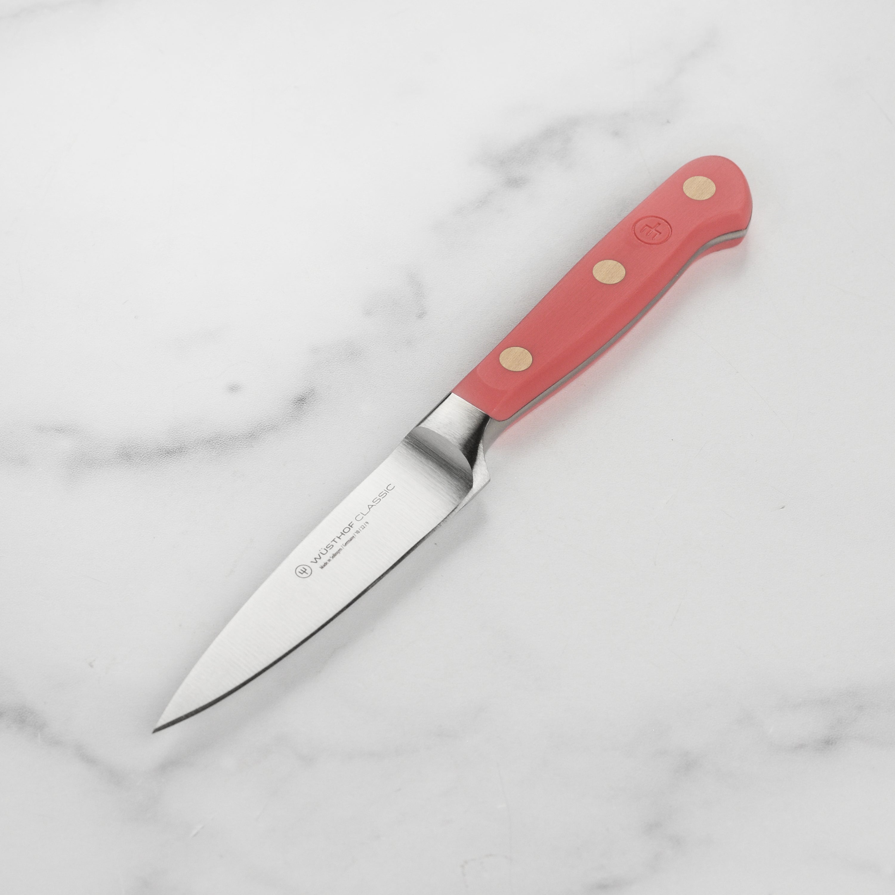 Wusthof Classic Coral Peach Paring Knife from above showing the sharp blade and handle