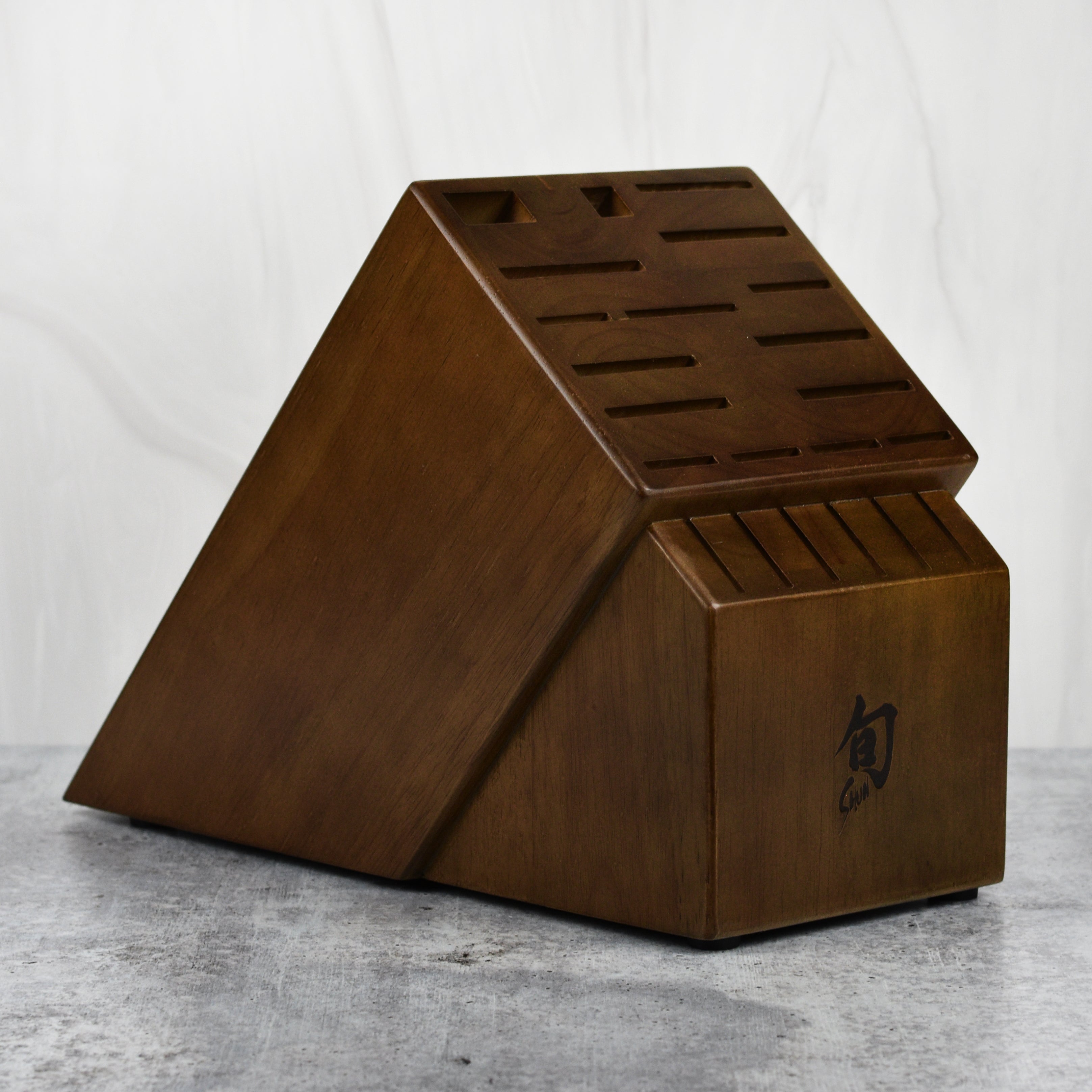 Walnut finish knife block with multiple slots for knives and steak knives