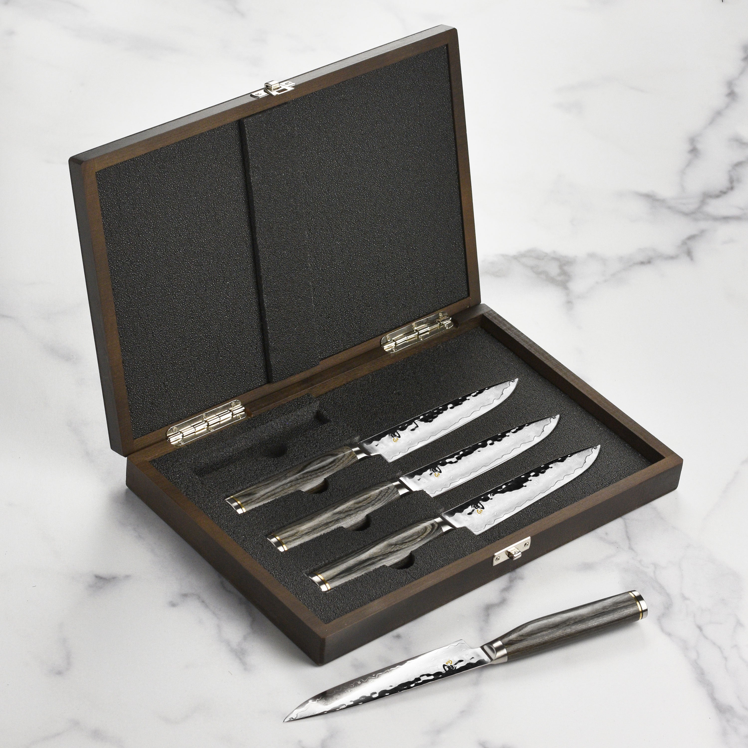 Close-up of the Shun Premier Damascus steak knife set highlighting the blade's detail.