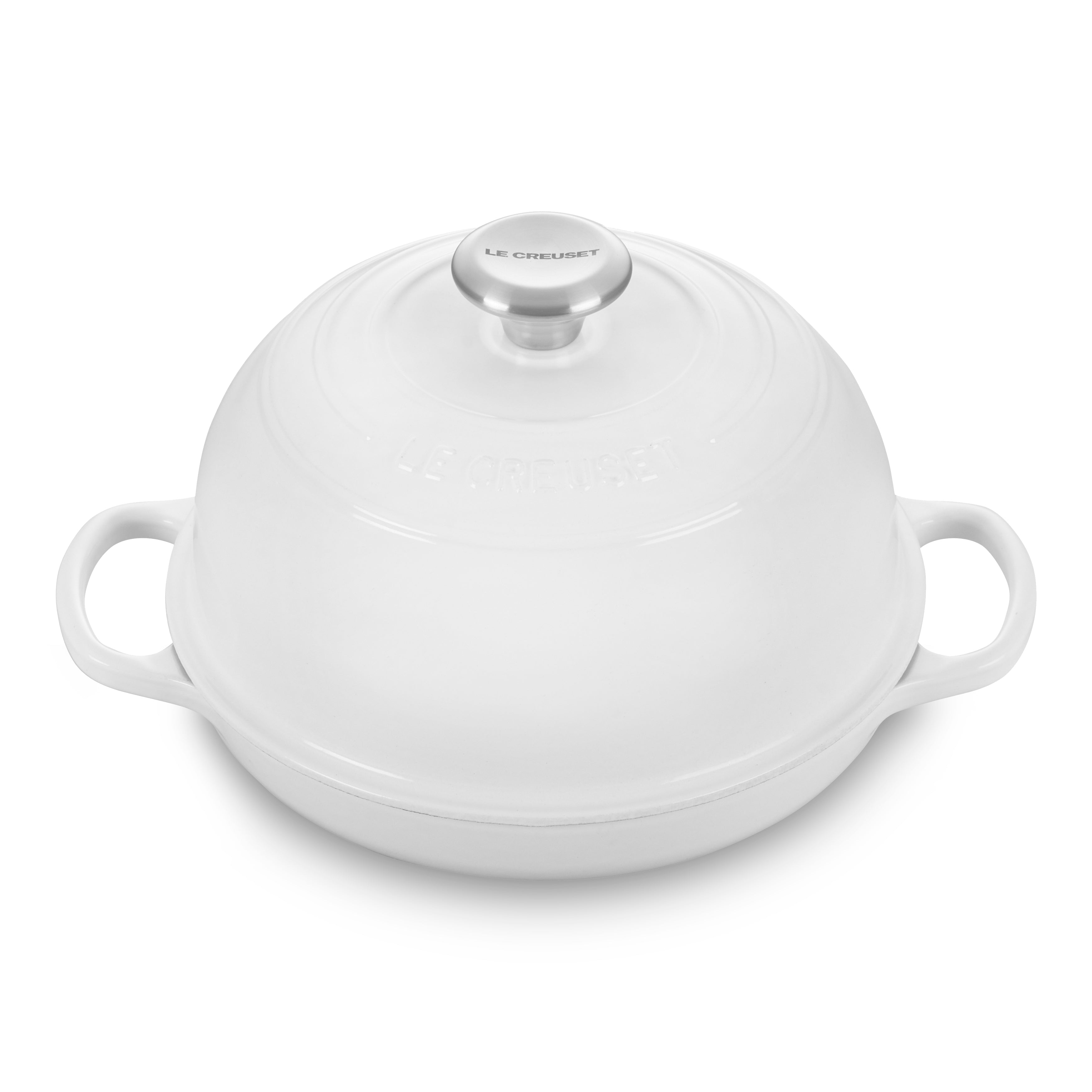Le Creuset enameled cast iron bread oven showing its durable enamel finish and ergonomic handles.