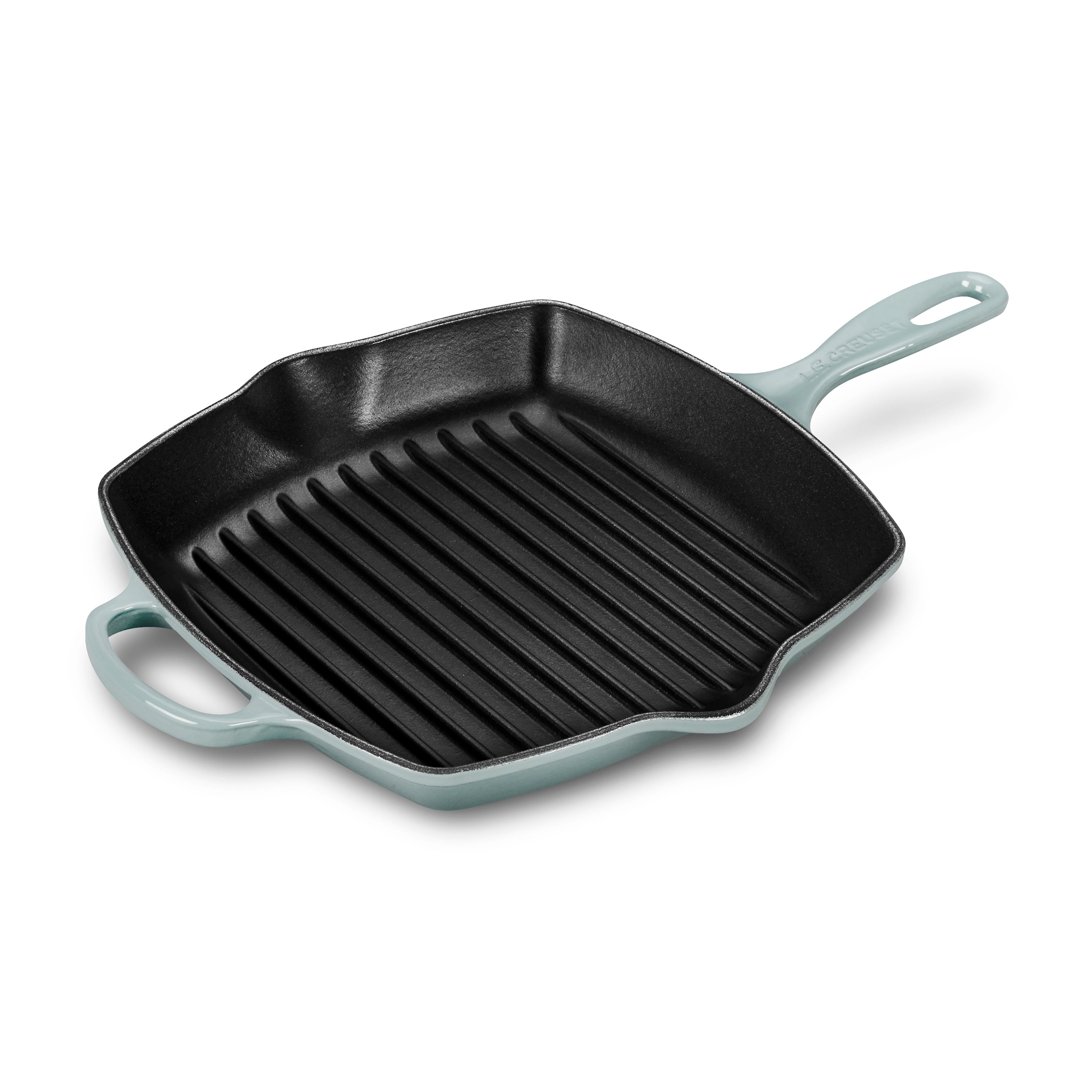 Top view of Le Creuset grill pan, highlighting its ridged surface and durable enamel finish.
