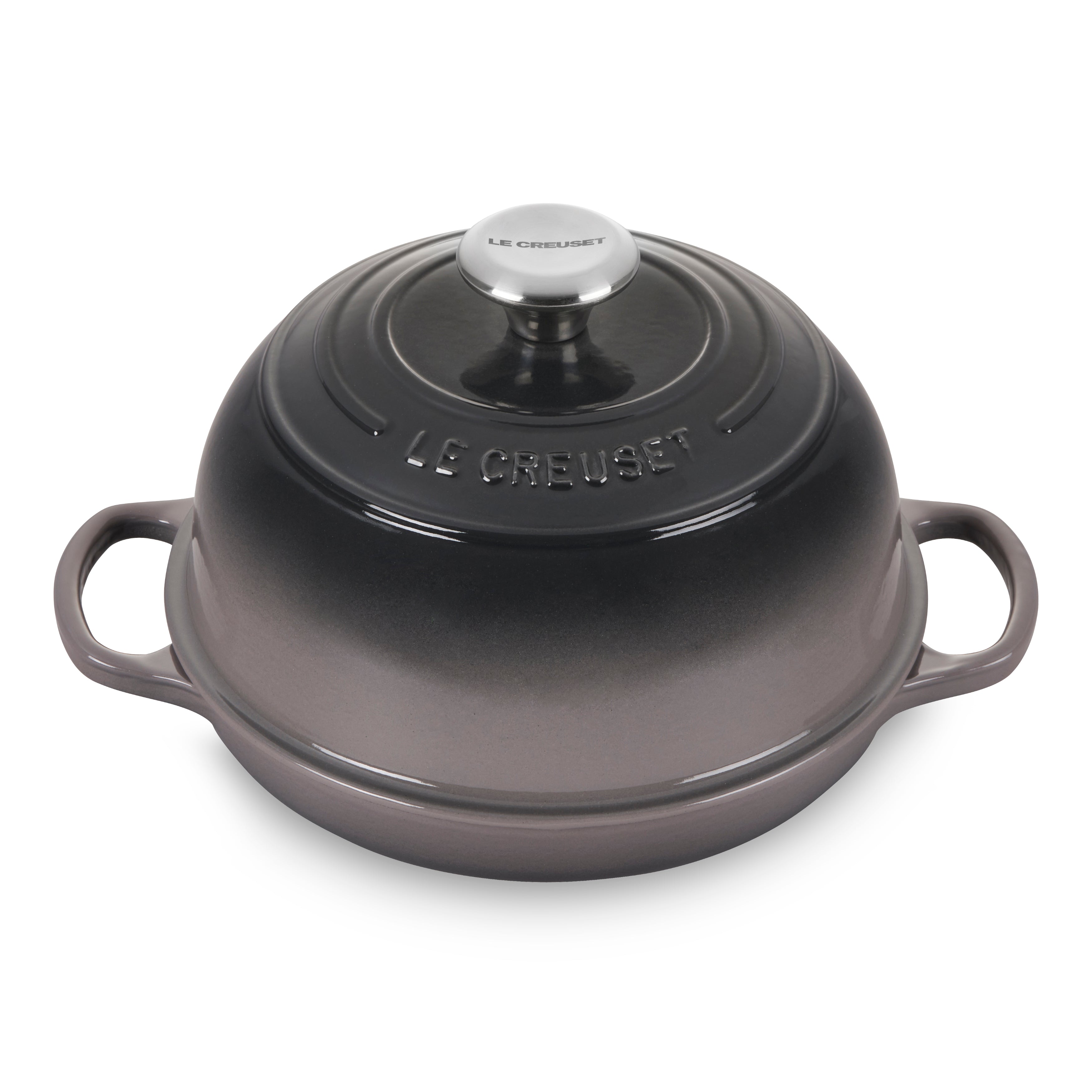 Le Creuset cast iron bread oven with lid open showing baked bread inside
