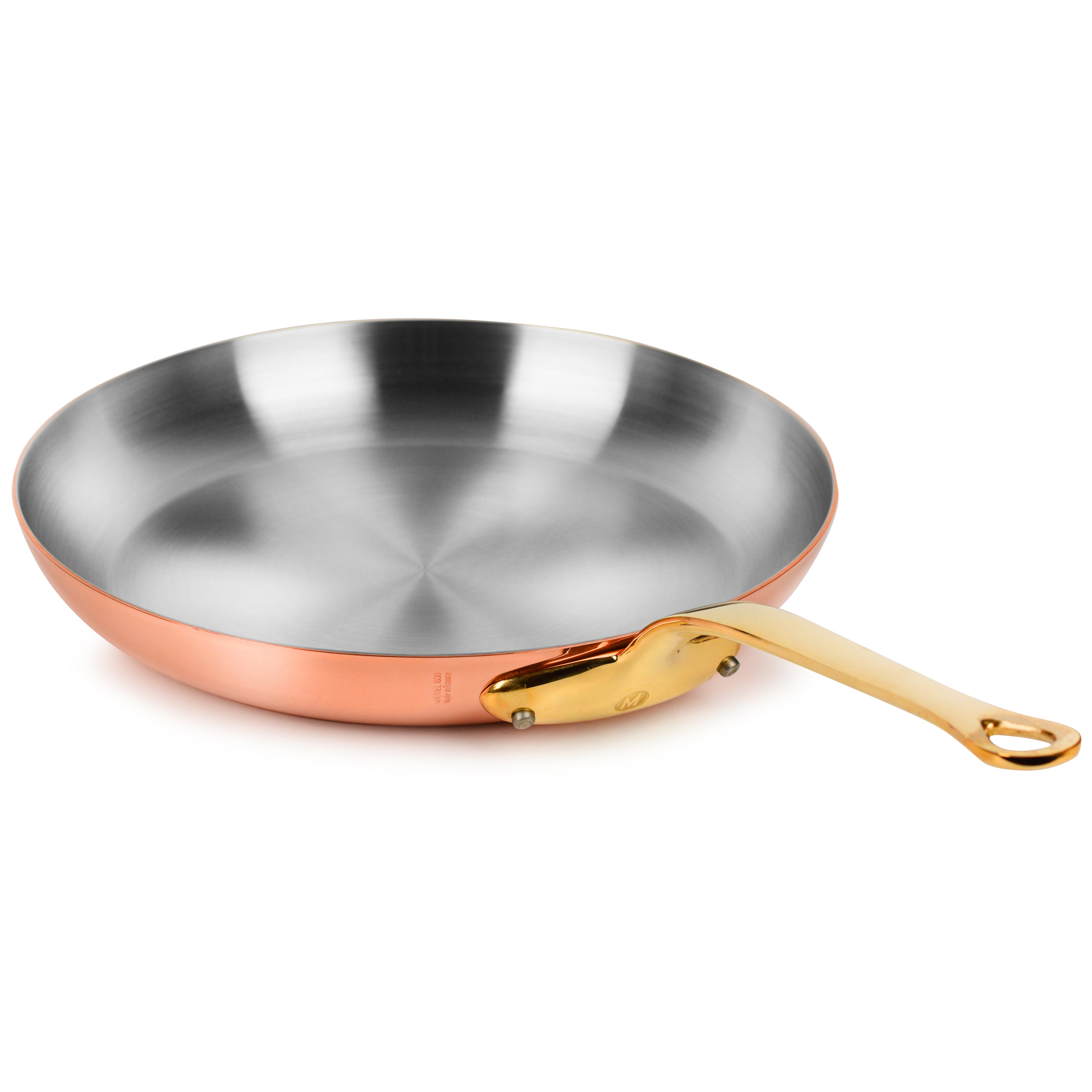 Angled view of the Mauviel M200B copper skillet showing bronze handle and mirror-polished copper finish