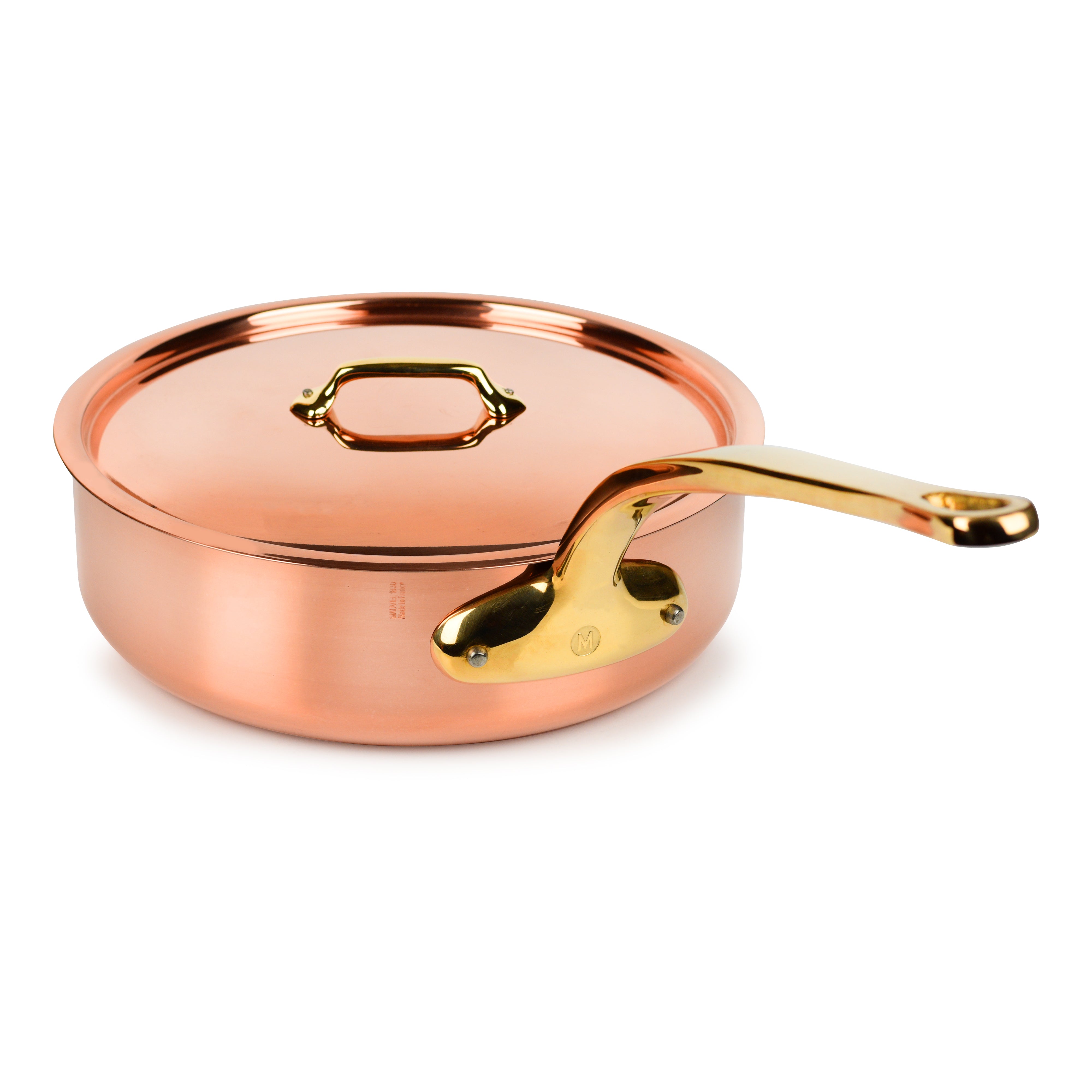 Close-up of the Mauviel M200B copper saute pan showing the copper handle and stainless steel rivets