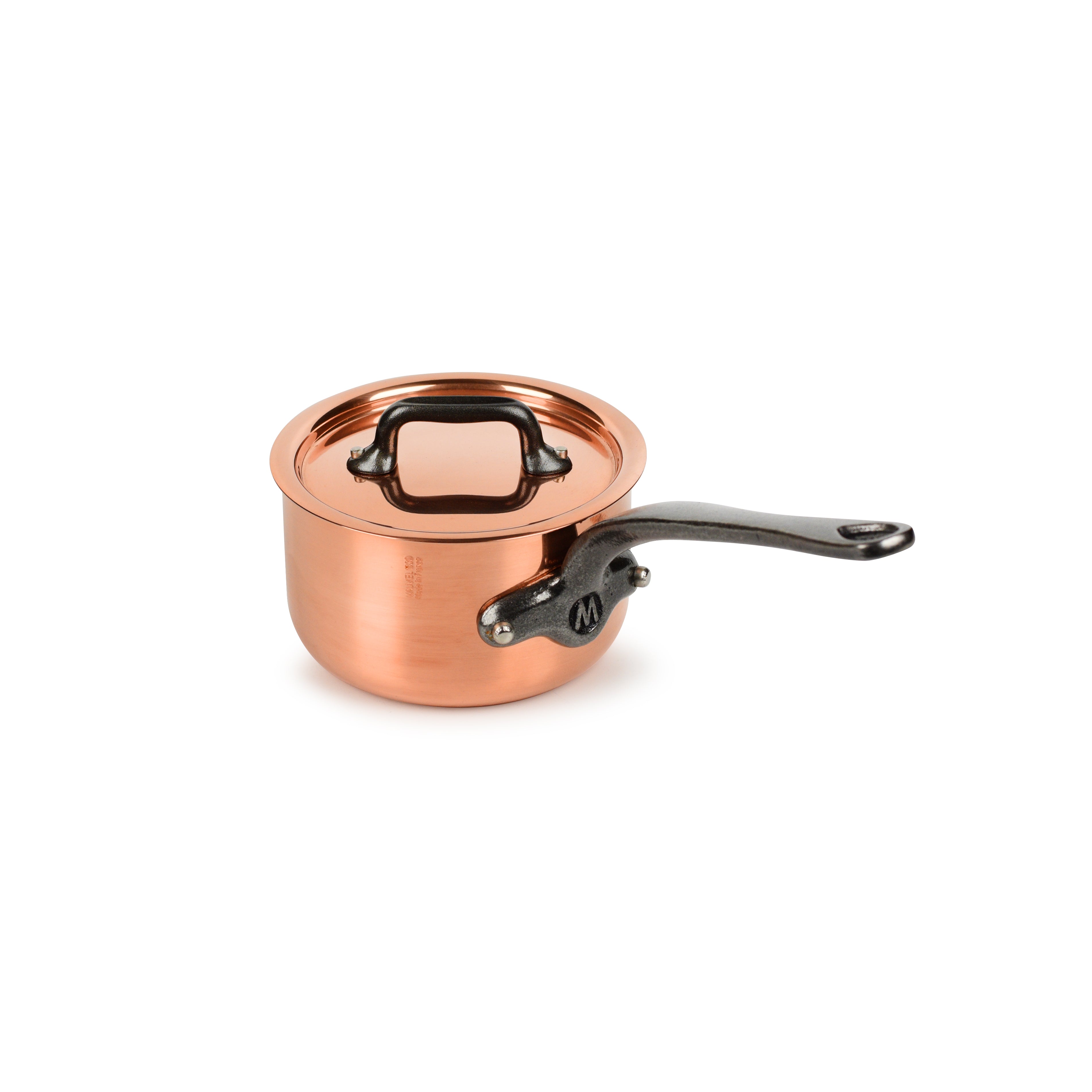 Mauviel M200Ci copper saucepan with lid on stovetop, showcasing its elegant design