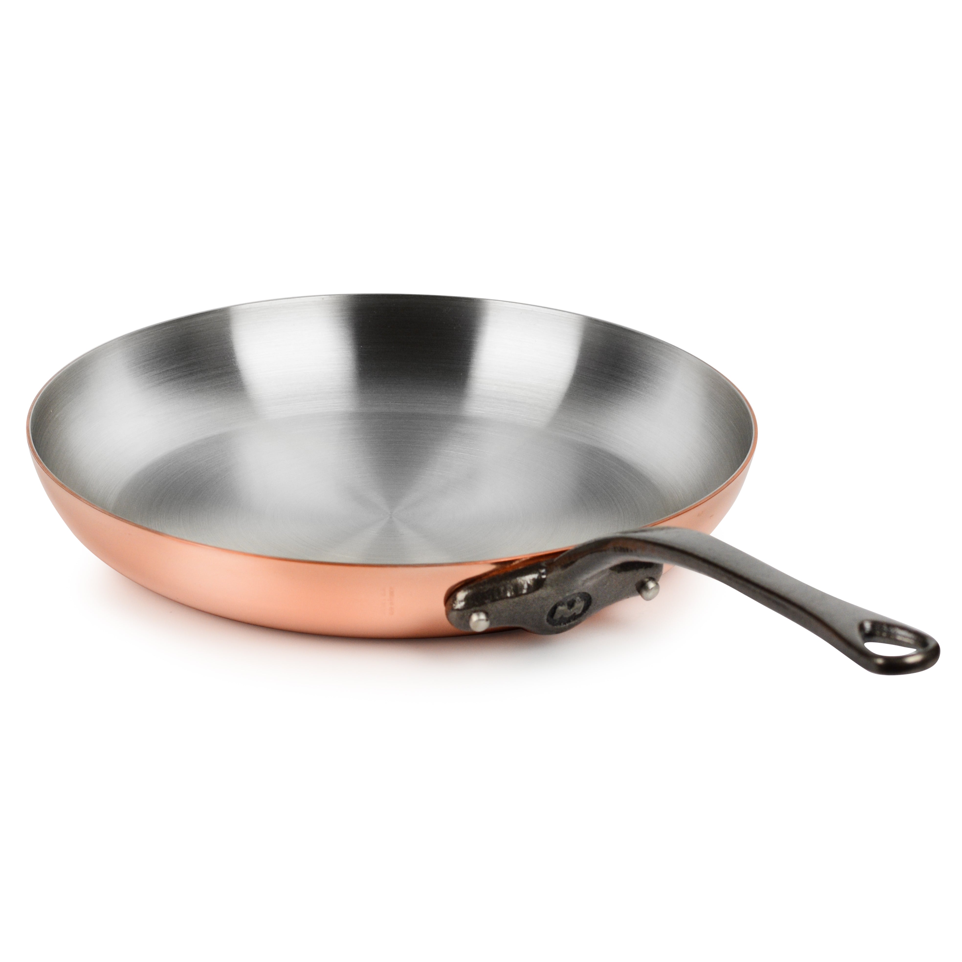 Close-up of Mauviel Copper Chef's Skillet with a frying steak inside, demonstrating heat conductivity.