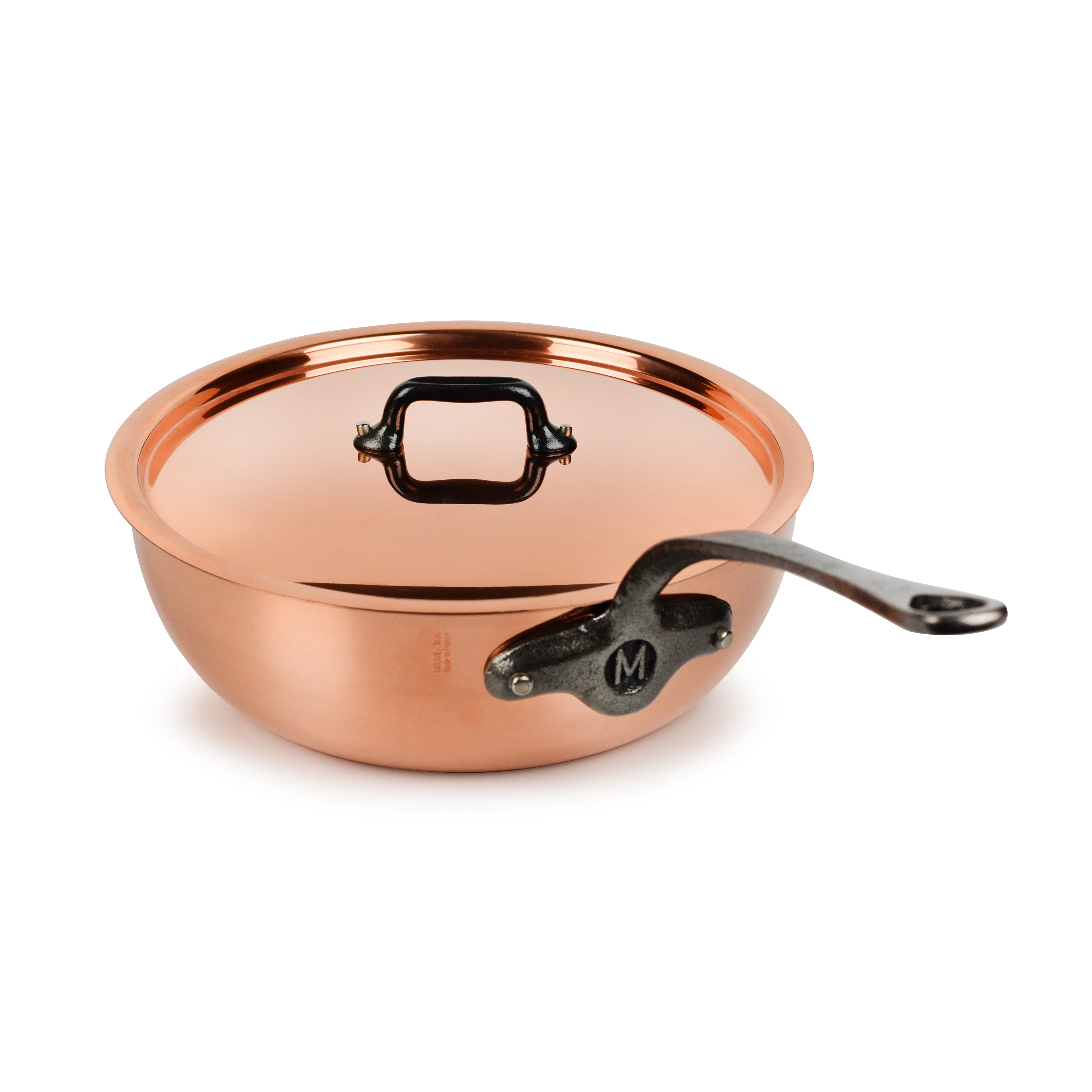 Mauviel M200Ci copper saucier with stainless steel handle on a professional stove