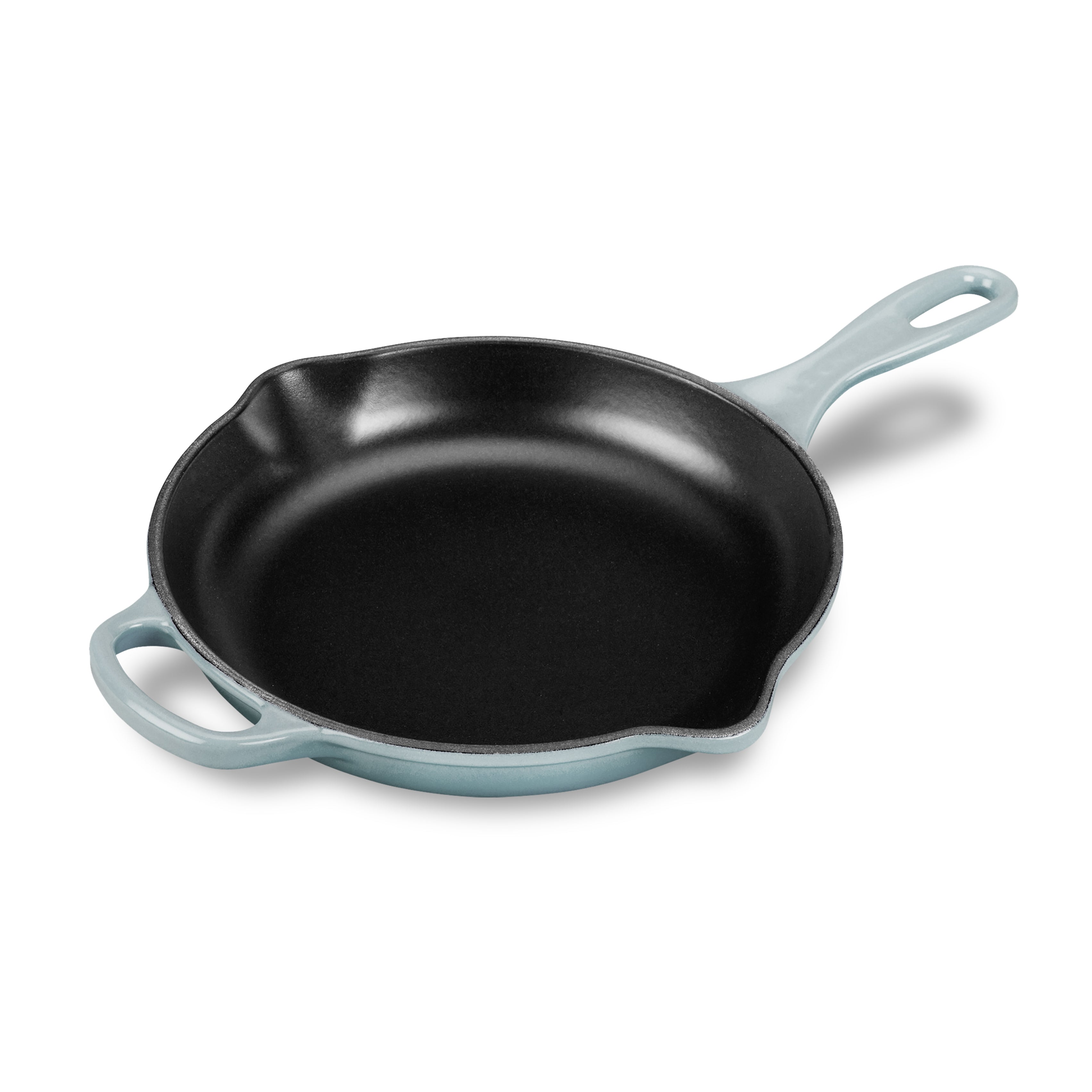 Le Creuset 9-inch enameled cast iron skillet with Sea Salt finish on stove