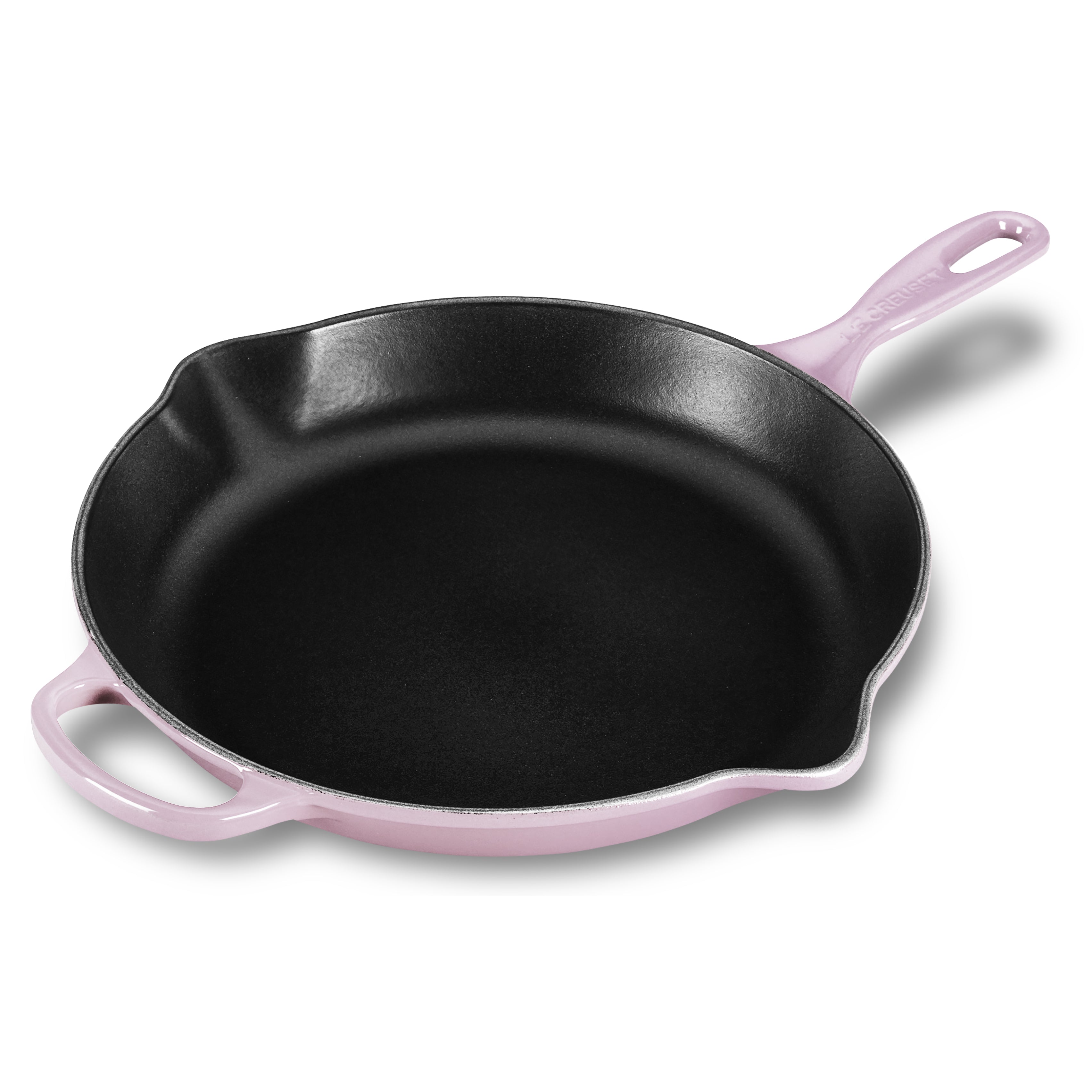 Le Creuset cast iron skillet on stove with heat distribution focus