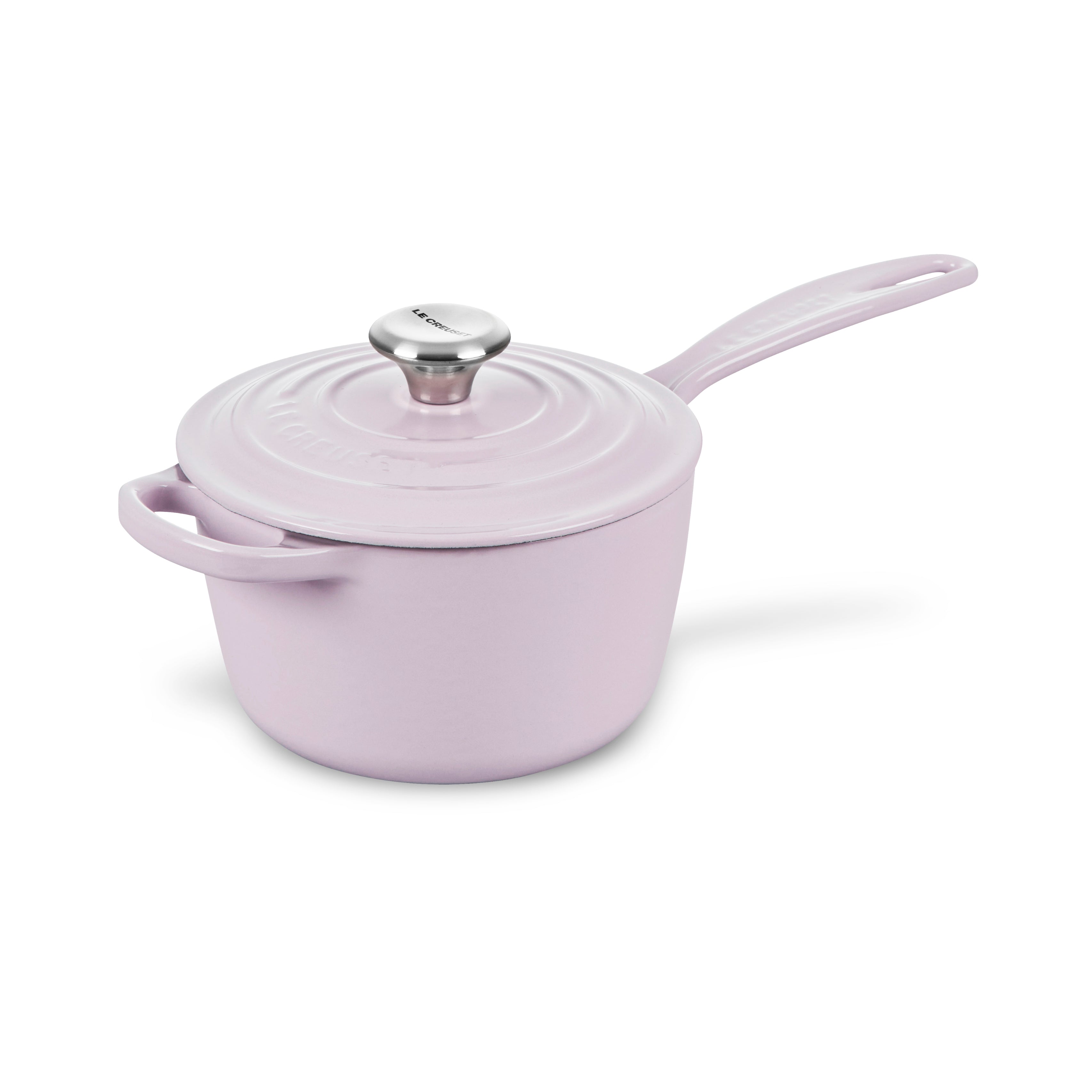 Le Creuset cast iron saucepan on induction stovetop with lid on