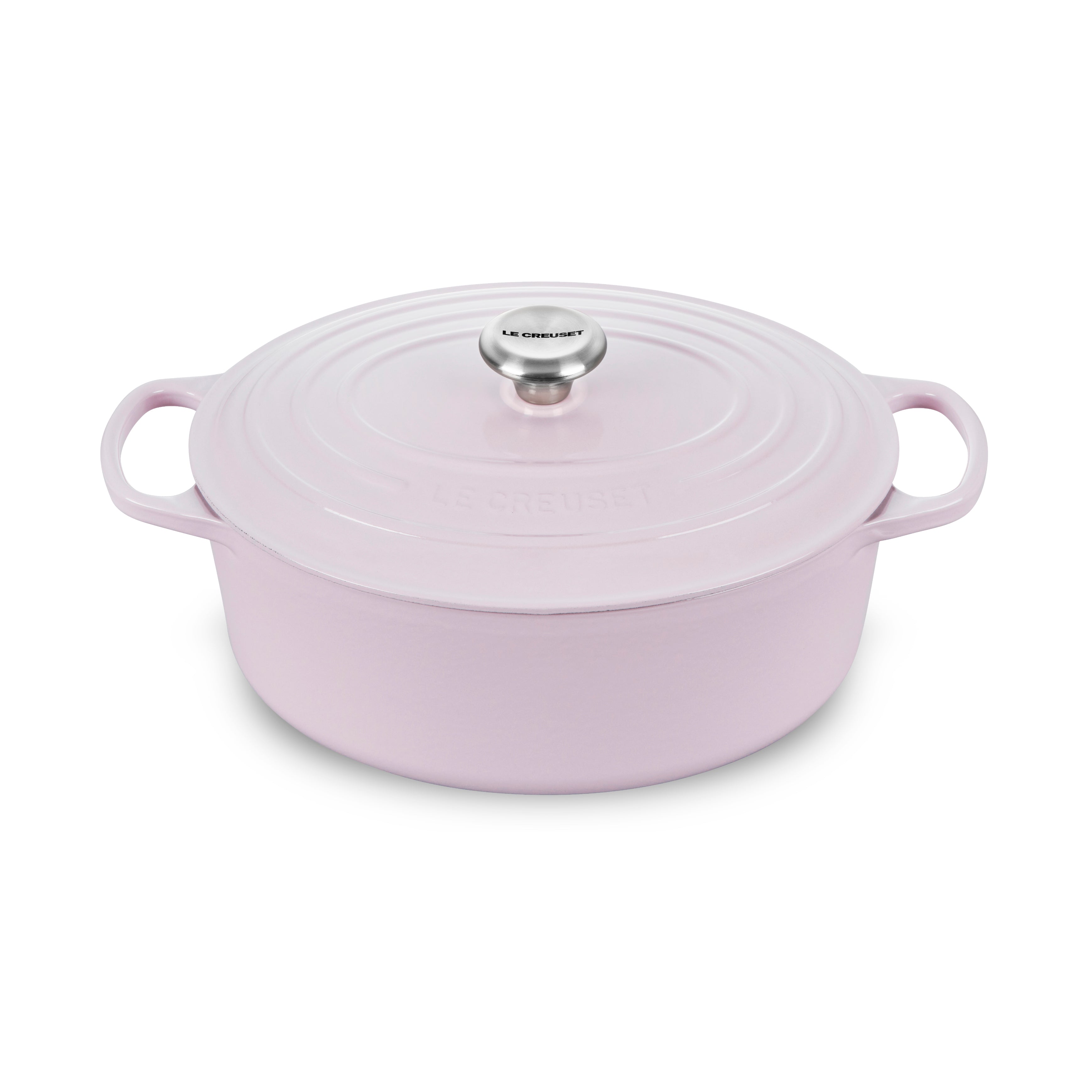 Le Creuset enameled cast iron Dutch oven on stovetop, showcasing its durable enamel finish