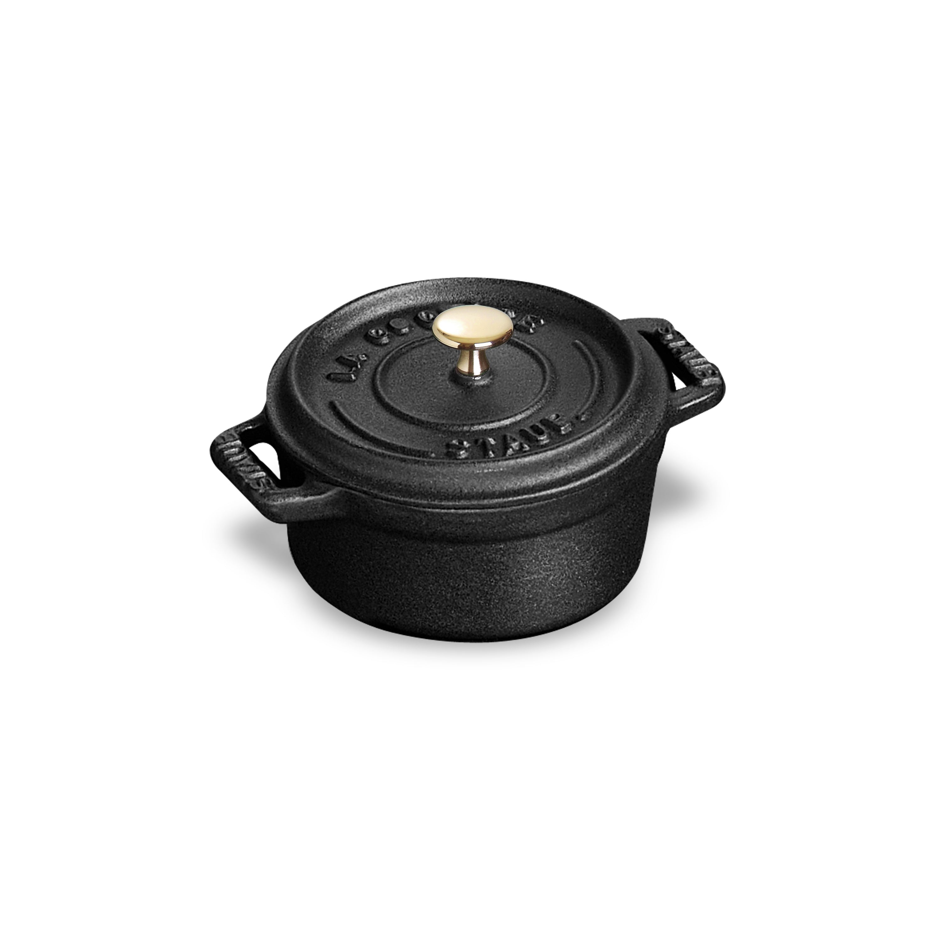Close-up of the Staub Matte Black Mini Round Dutch Oven highlighting its textured interior.