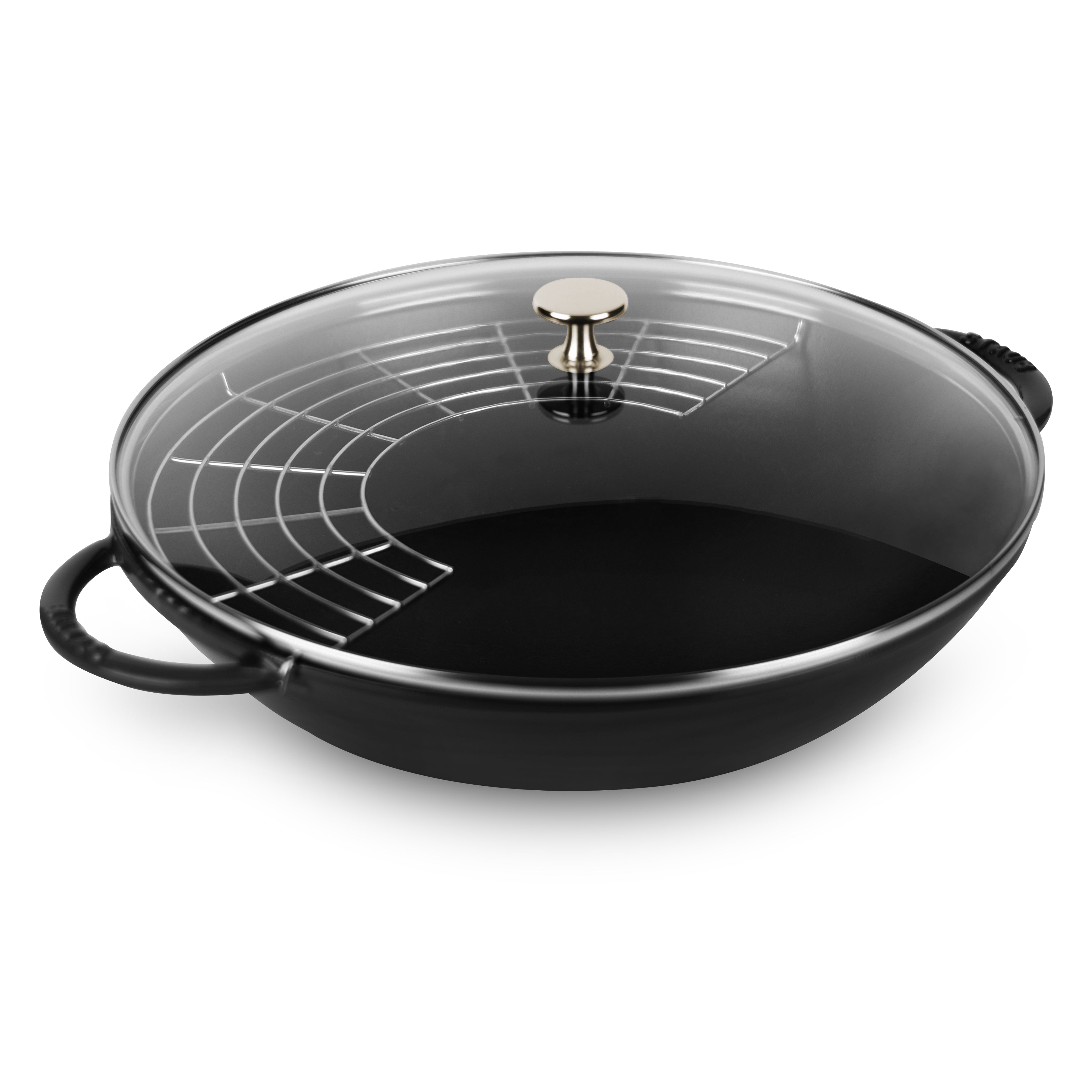 Close-up of Staub 14-inch matte black enameled wok with glass lid, showing textured interior and sleek design