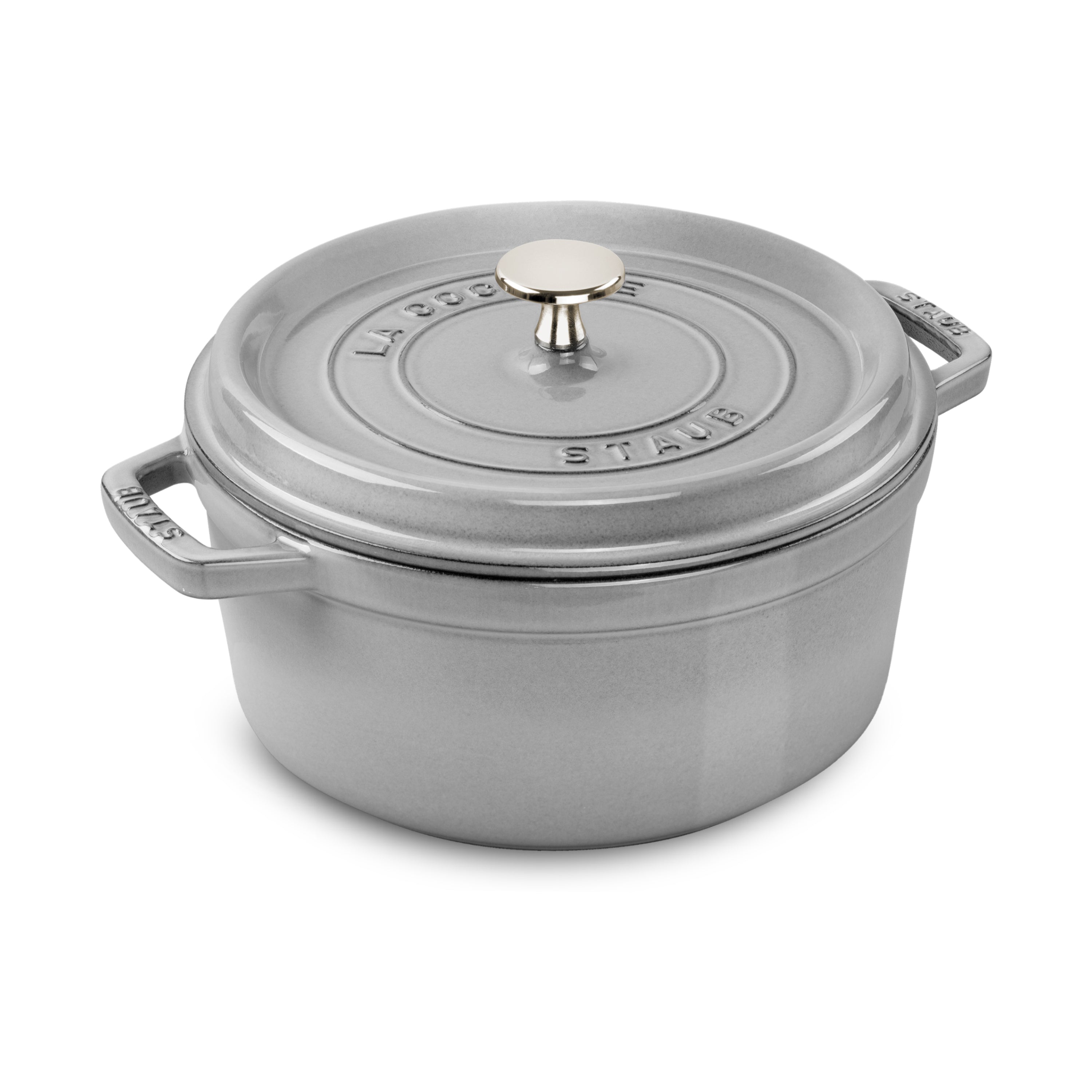 Graphite Gray Staub Enameled Dutch Oven on a wooden table, showcasing its elegant design.