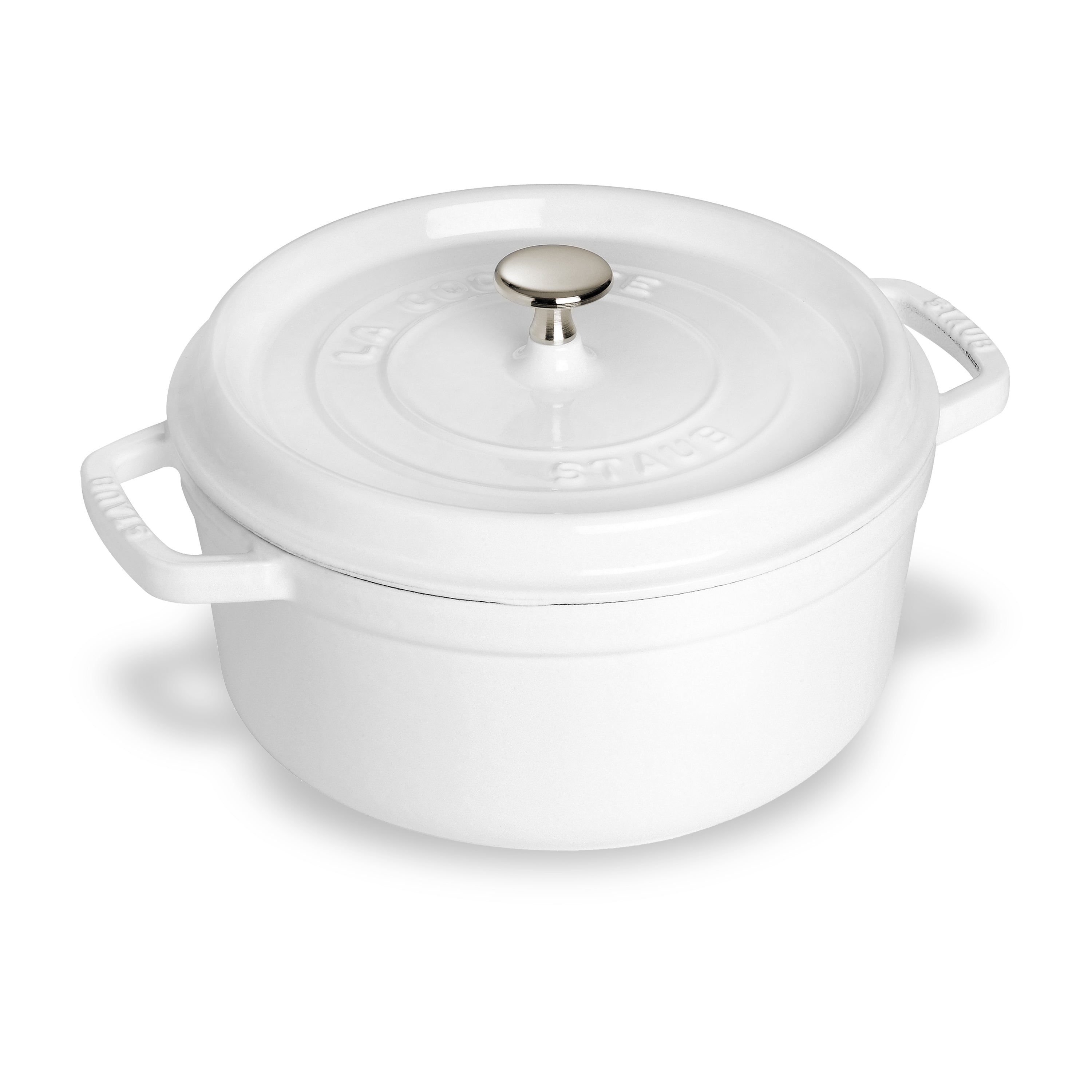 Le Creuset 7-quart white Dutch oven with lid showing its enamel surface and handles, perfect for baking and roasting