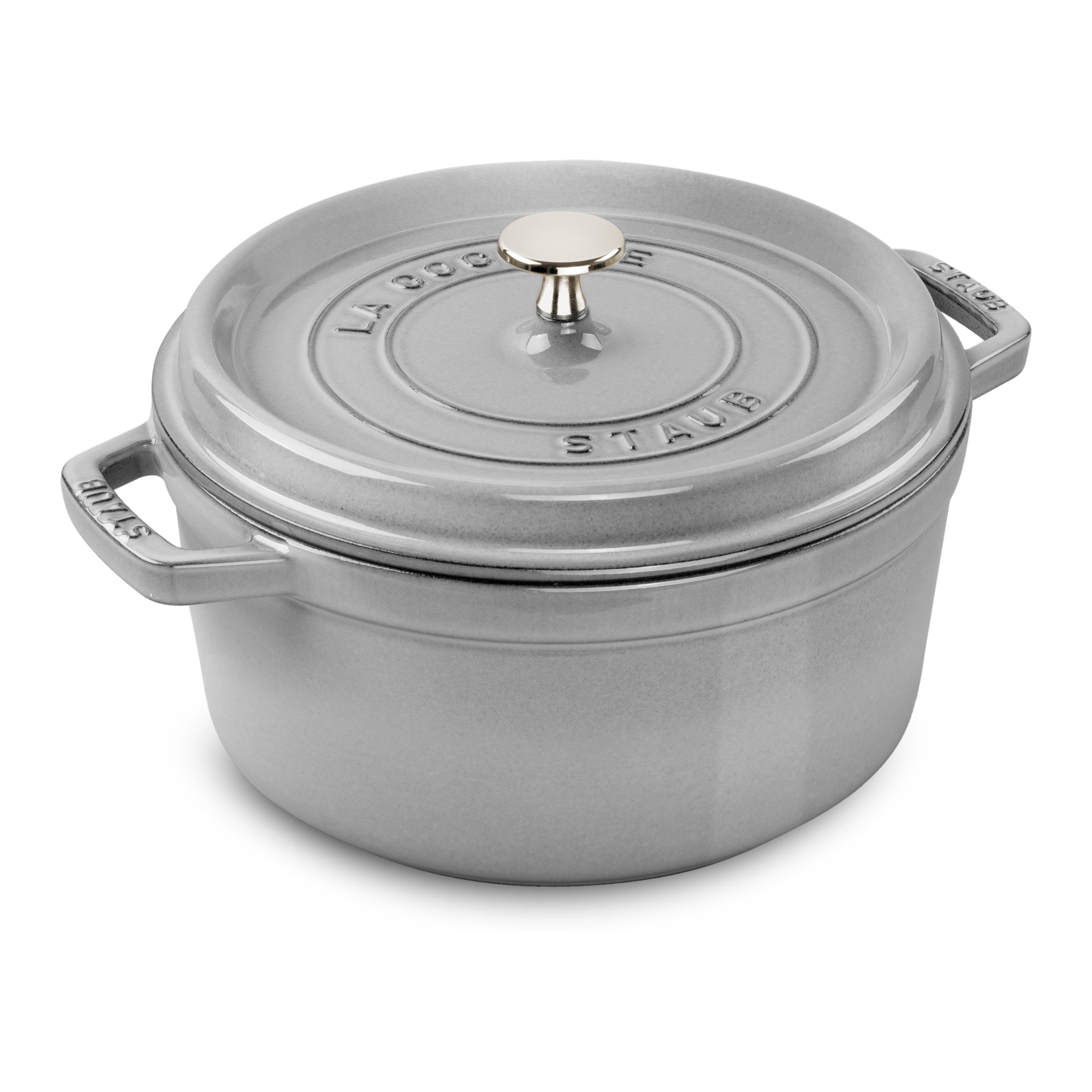Staub 9-quart round Dutch oven in use on an induction stovetop, showcasing its versatility and sleek design.