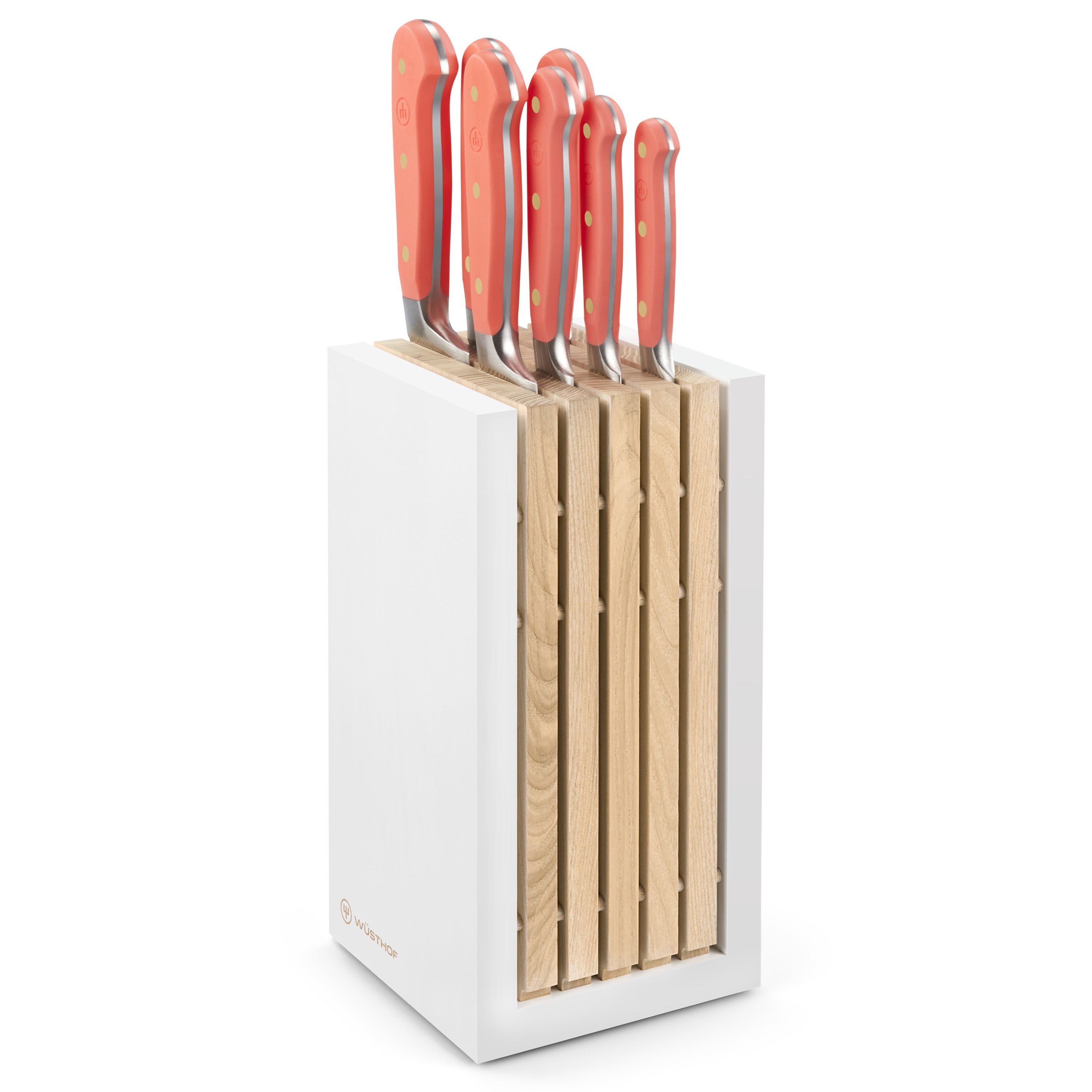 Wusthof Classic 8-Piece Knife Block Set with vibrant coral peach block, highlighting the superior craftsmanship and design.