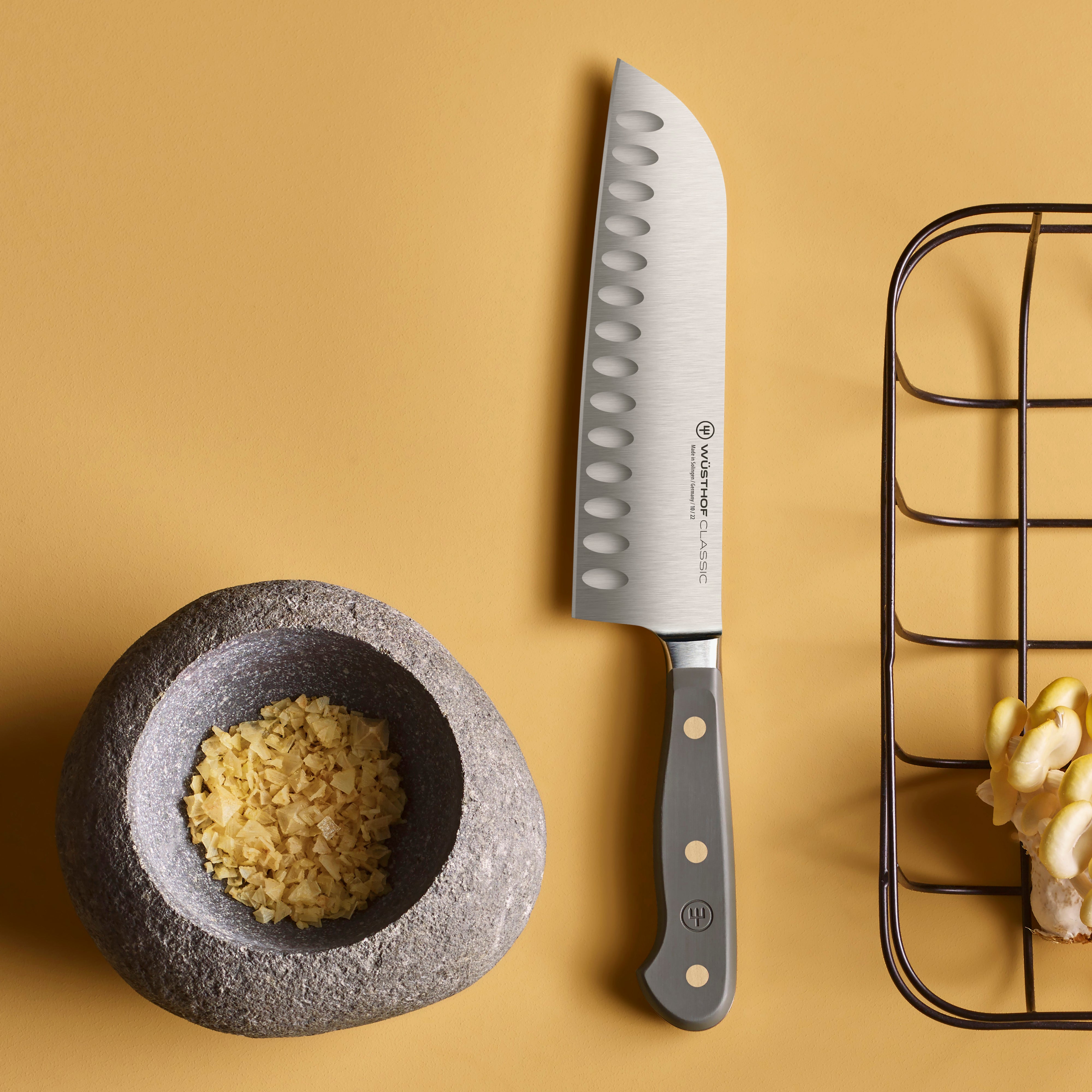 Close-up of the sharp edge of the Santoku knife for precision slicing