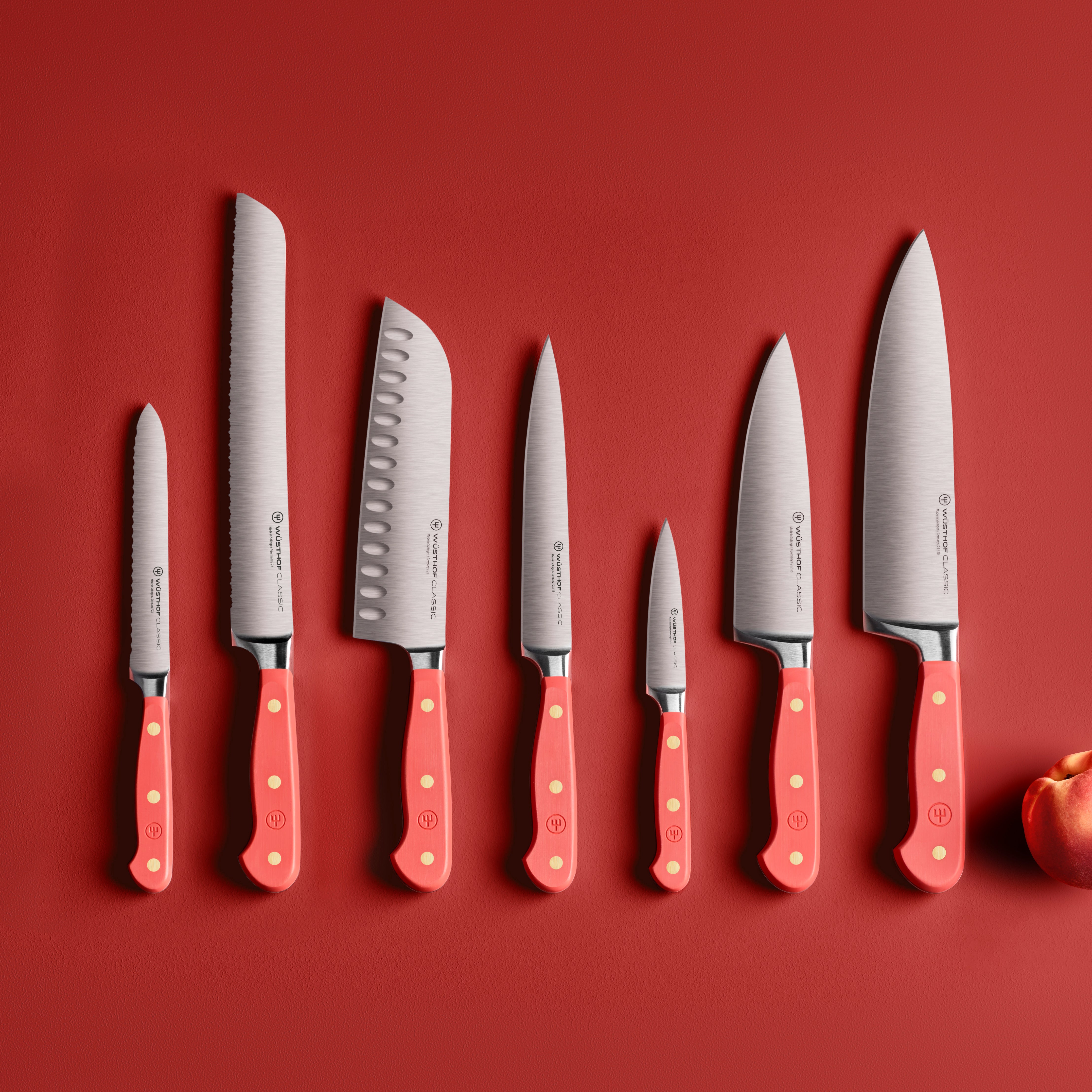 Close-up of the Wusthof chef knives in the knife block, illustrating the precision edge technology and sharpness.
