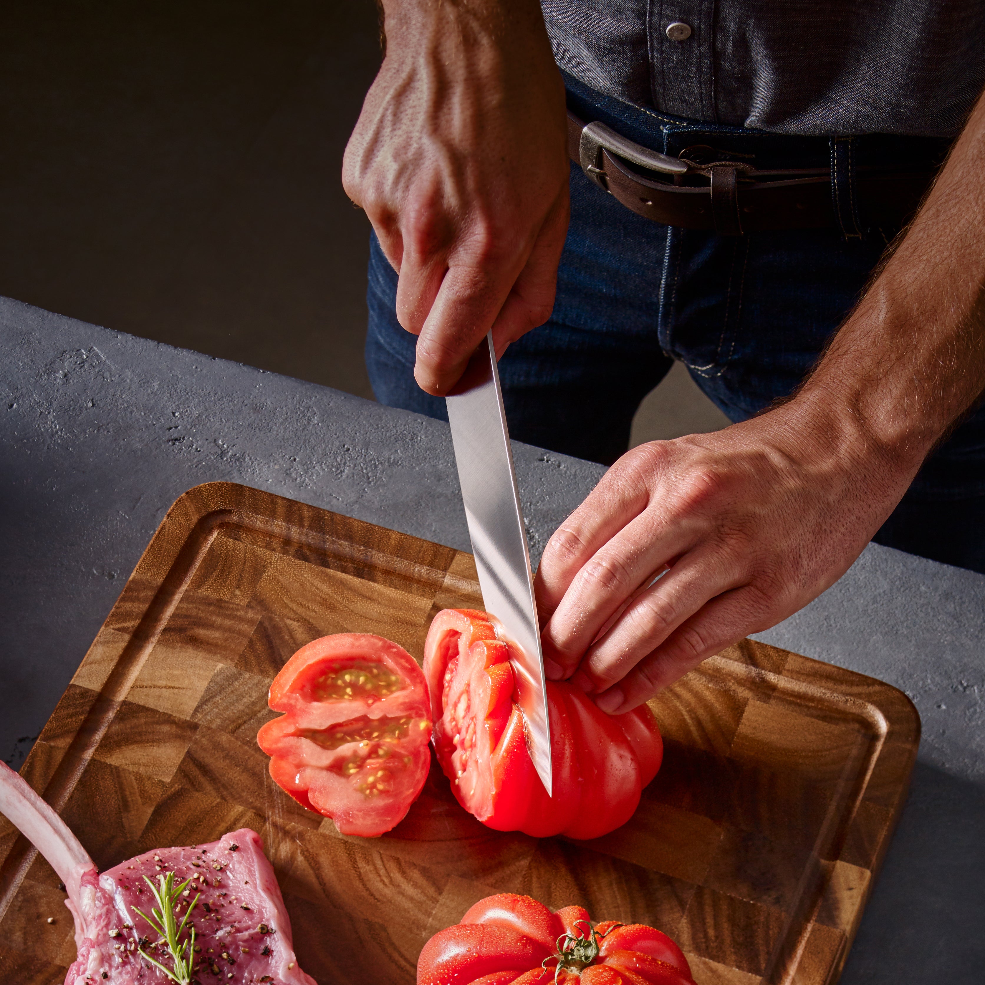 Side view of the chefs knife handle highlighting triple-riveted POM material